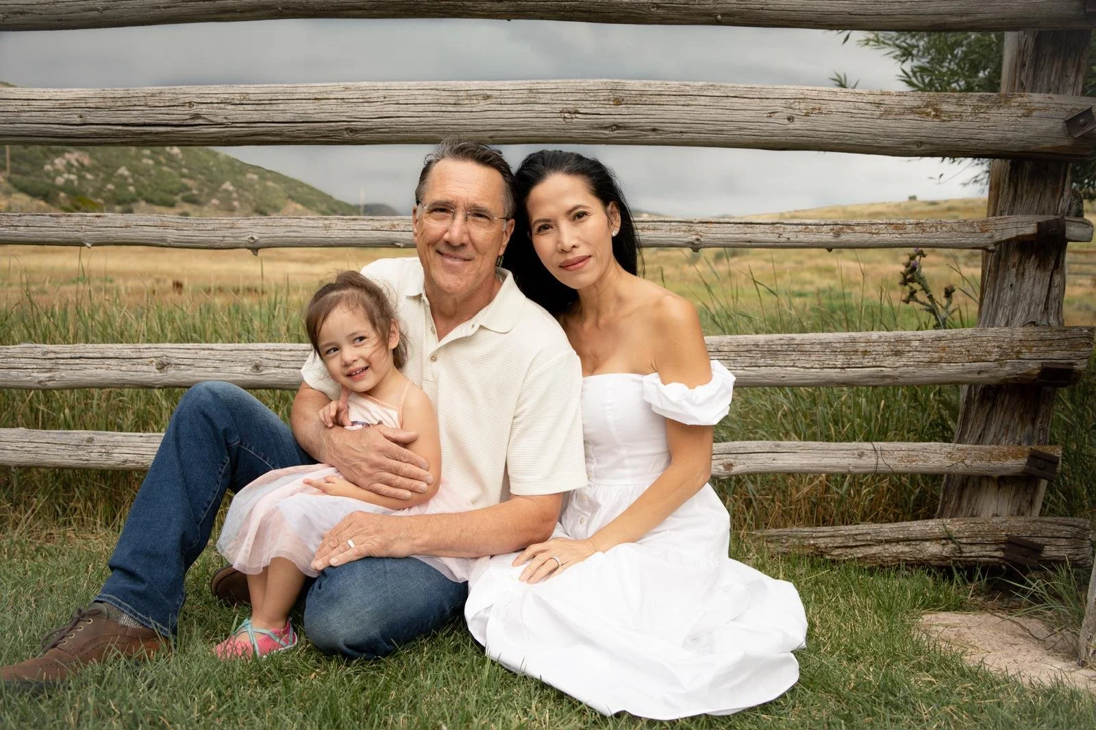 Portrait of Kimberly, husband and young toddler daughter on a beautiful ranch landscape setting.  Now living with stage 4 ALK+ lung cancer.