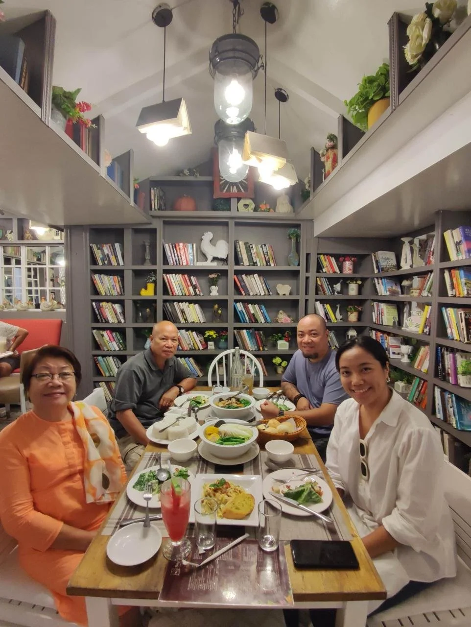 Tristan_family_dinner_among_bookshelves.jpeg