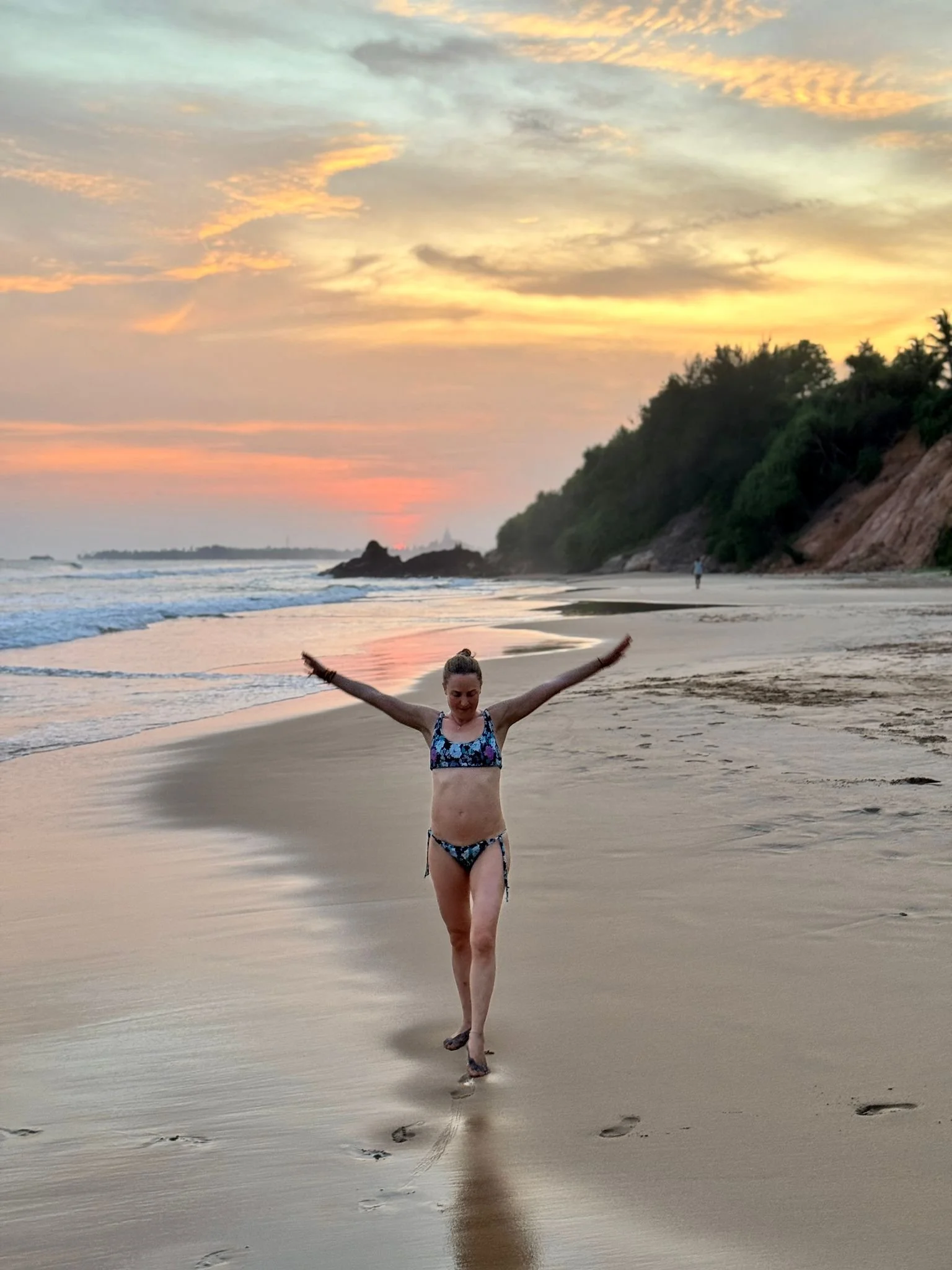Kathrin walking on a beautiful beach. Grateful for a second chance of life after her lung cancer diagnosis