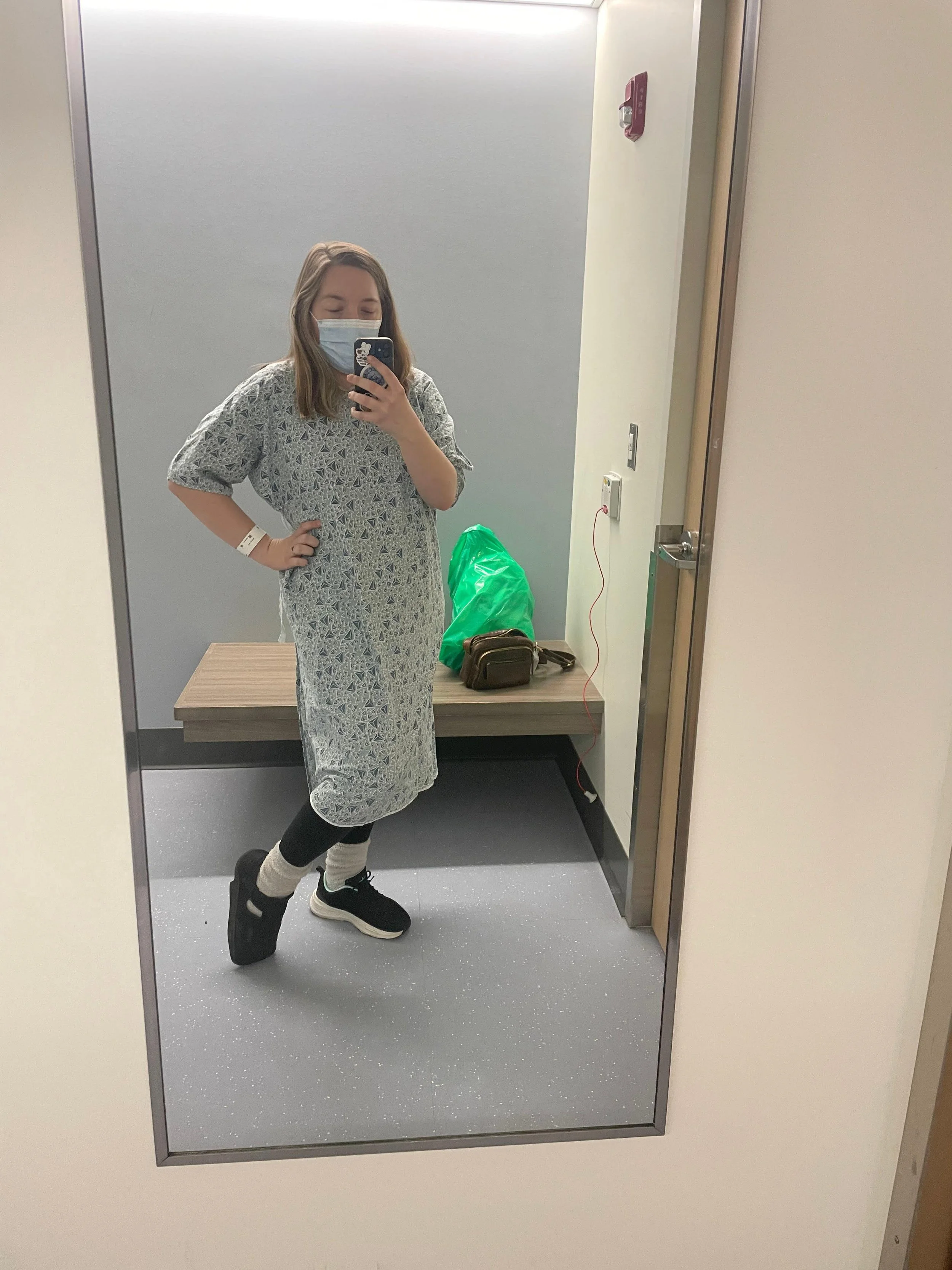 Striking a pose in the hospital gown changing room