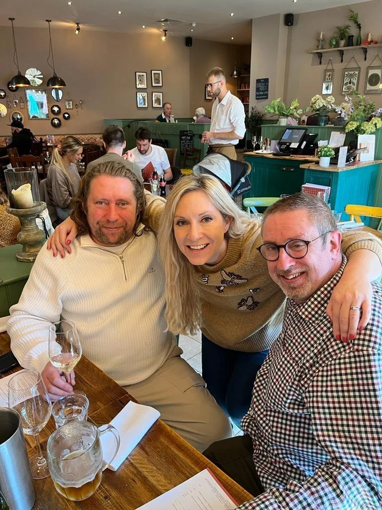 Jenny's two sons and her daughter - at a restaurant together.