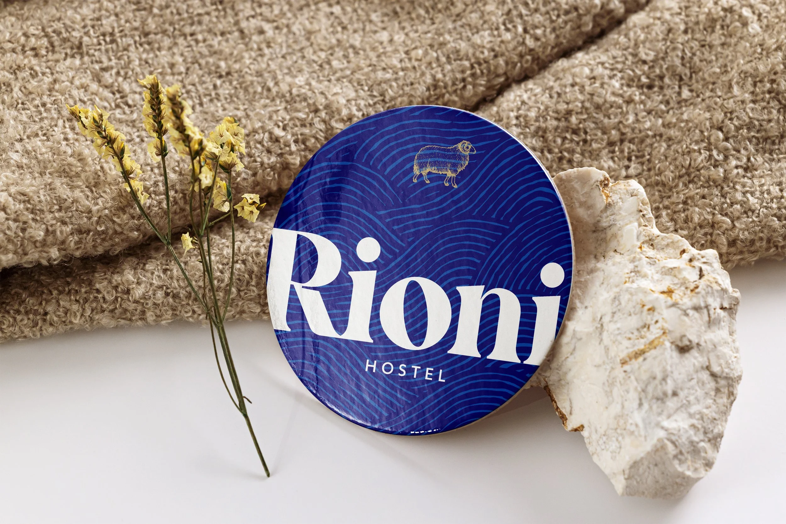 visual concept for a branded beer mat for Rioni Hostel