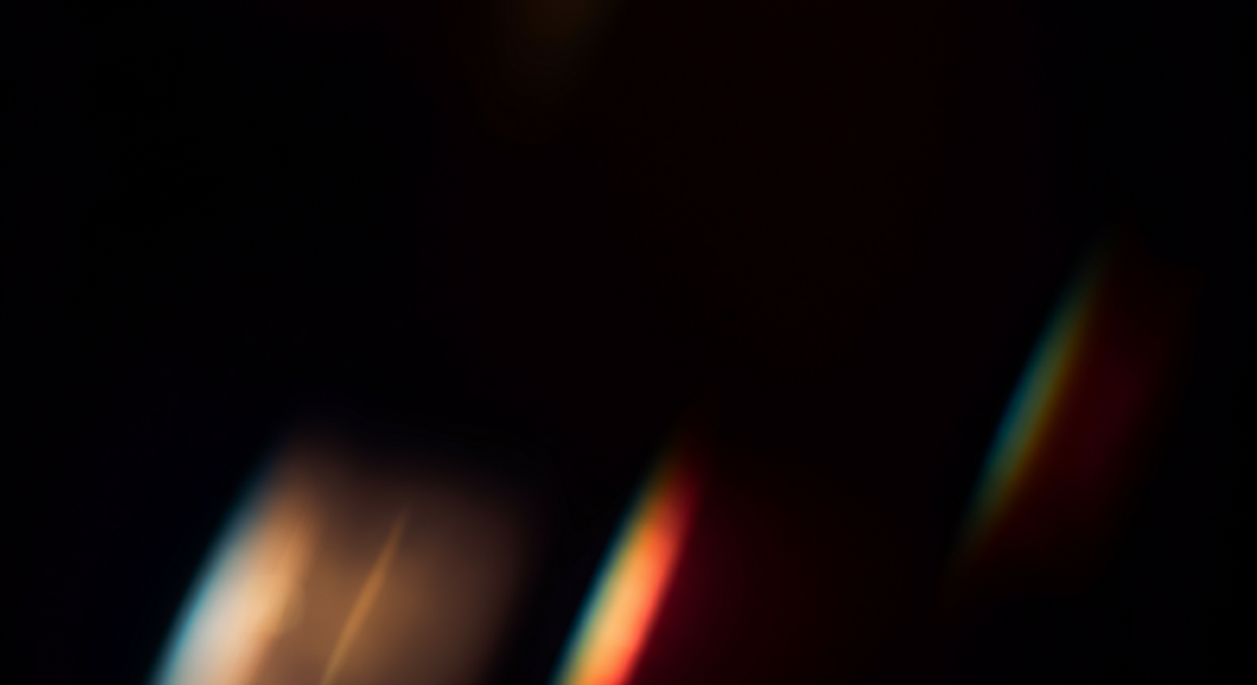 A doorway-shaped image of black with a red, yellow, and blue moving light in the middle; the whole image undulating in motion