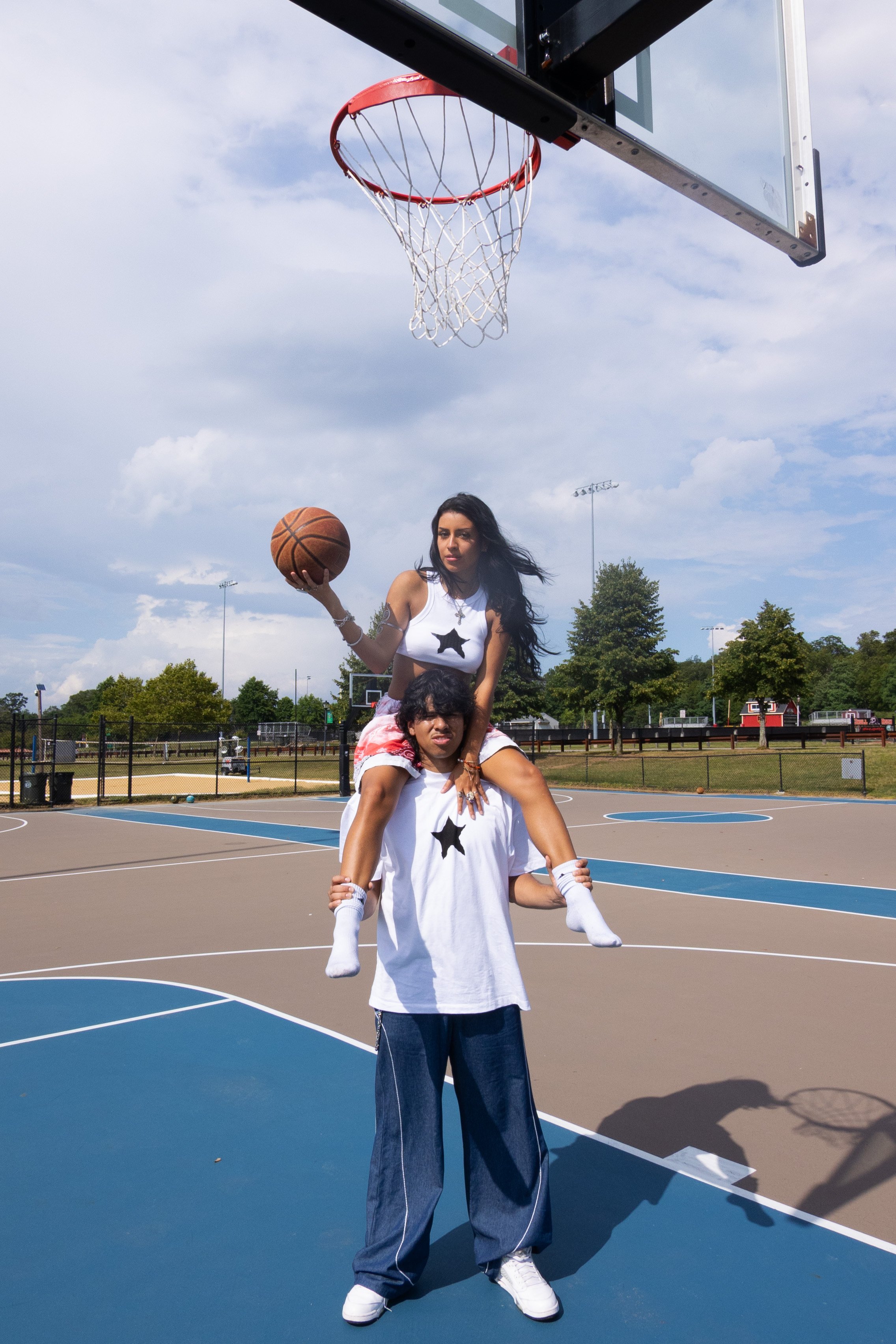 TIFF AND EVAN UNDER HOOP.jpg