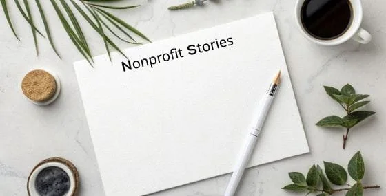 Notebook labeled “Nonprofit Stories” with pen and coffee, representing thoughtful nonprofit storytelling