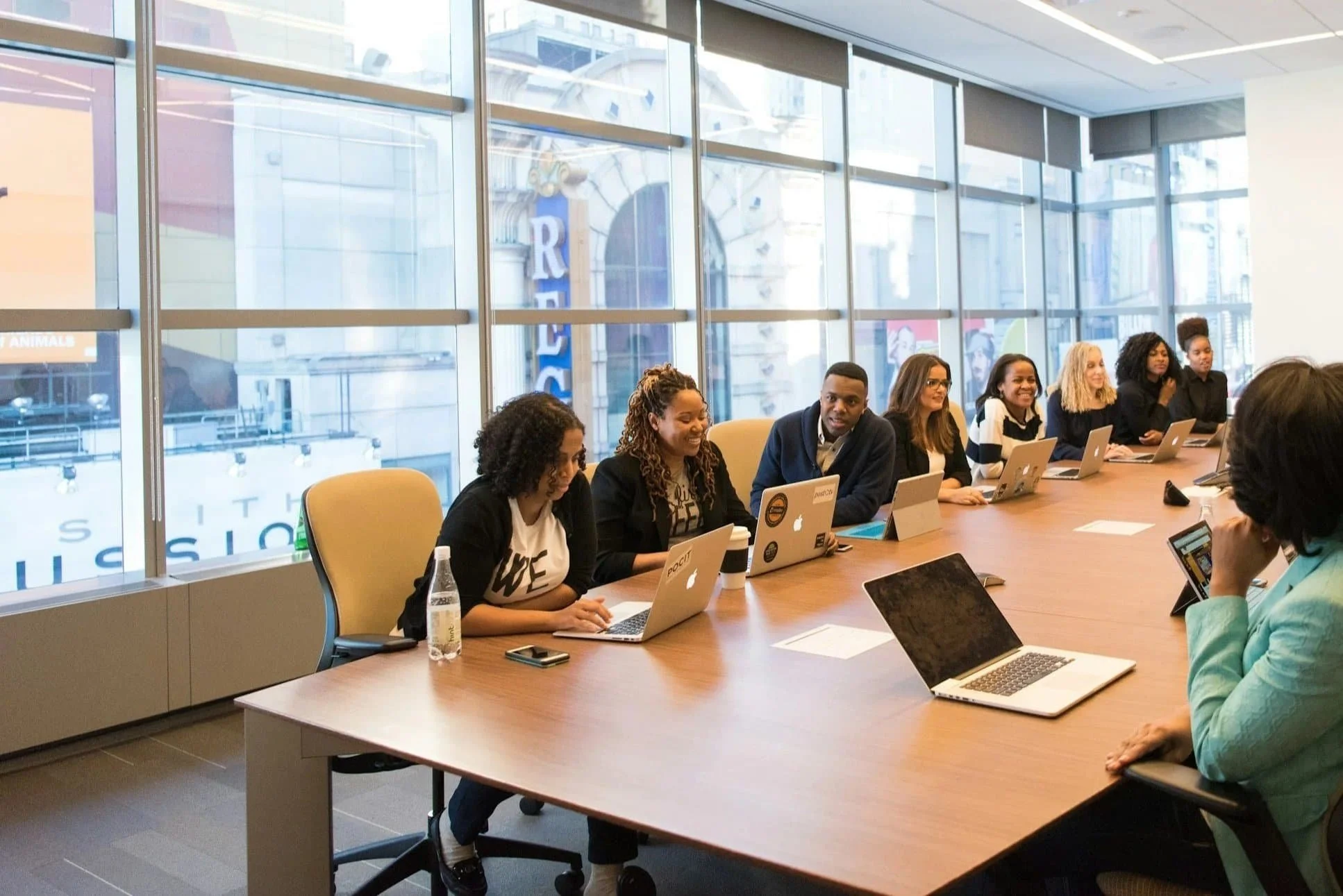 Nonprofit board members and leaders collaborating around a conference table during a leadership development session