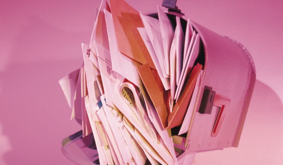 Mailbox overflowing with nonprofit fundraising letters — how to write a fundraising letter that gets opened