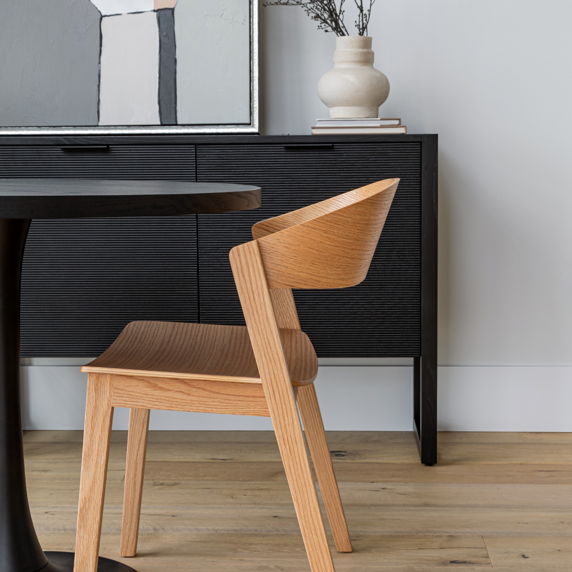 Dining Chairs category image showing modern upholstered dining chairs in a soft, neutral dining room, representing Furniture 28’s quiet-luxury collection.