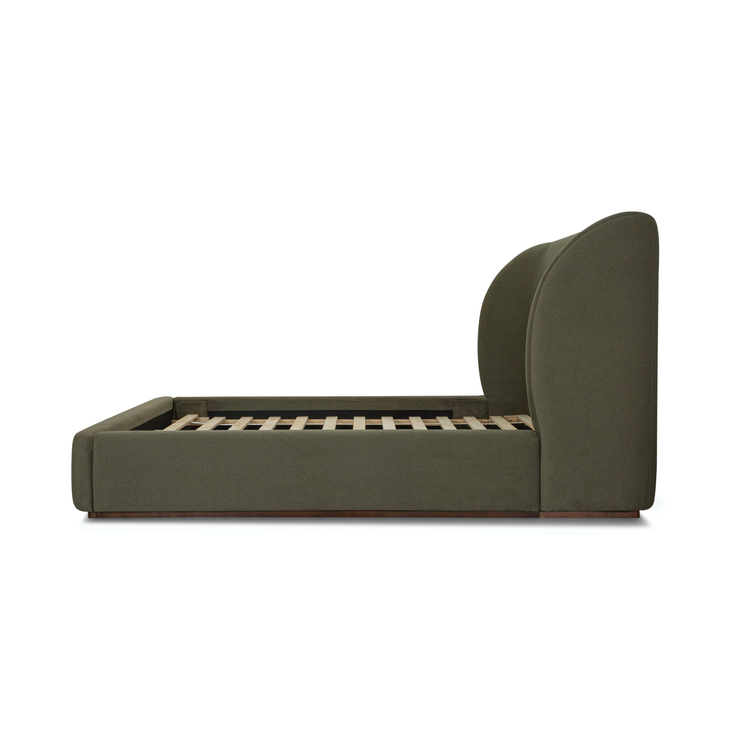 Modern 77 king size bed upholstered in deep green velvet fabric