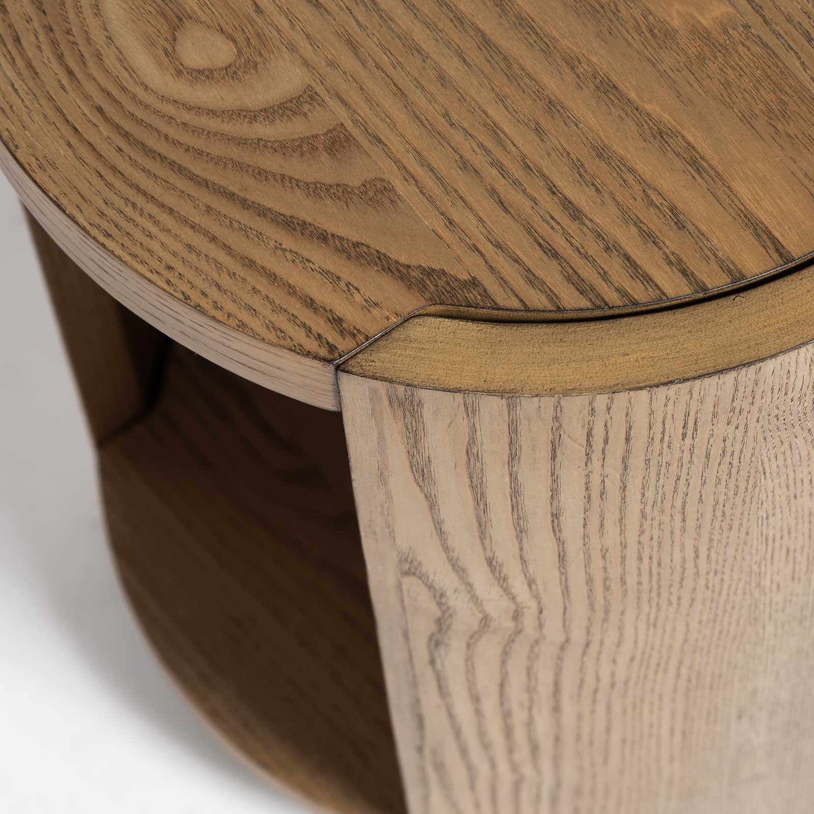 Close-up of natural oak wood grain and curved support panel on the 8 Side Table - Rustic Oak