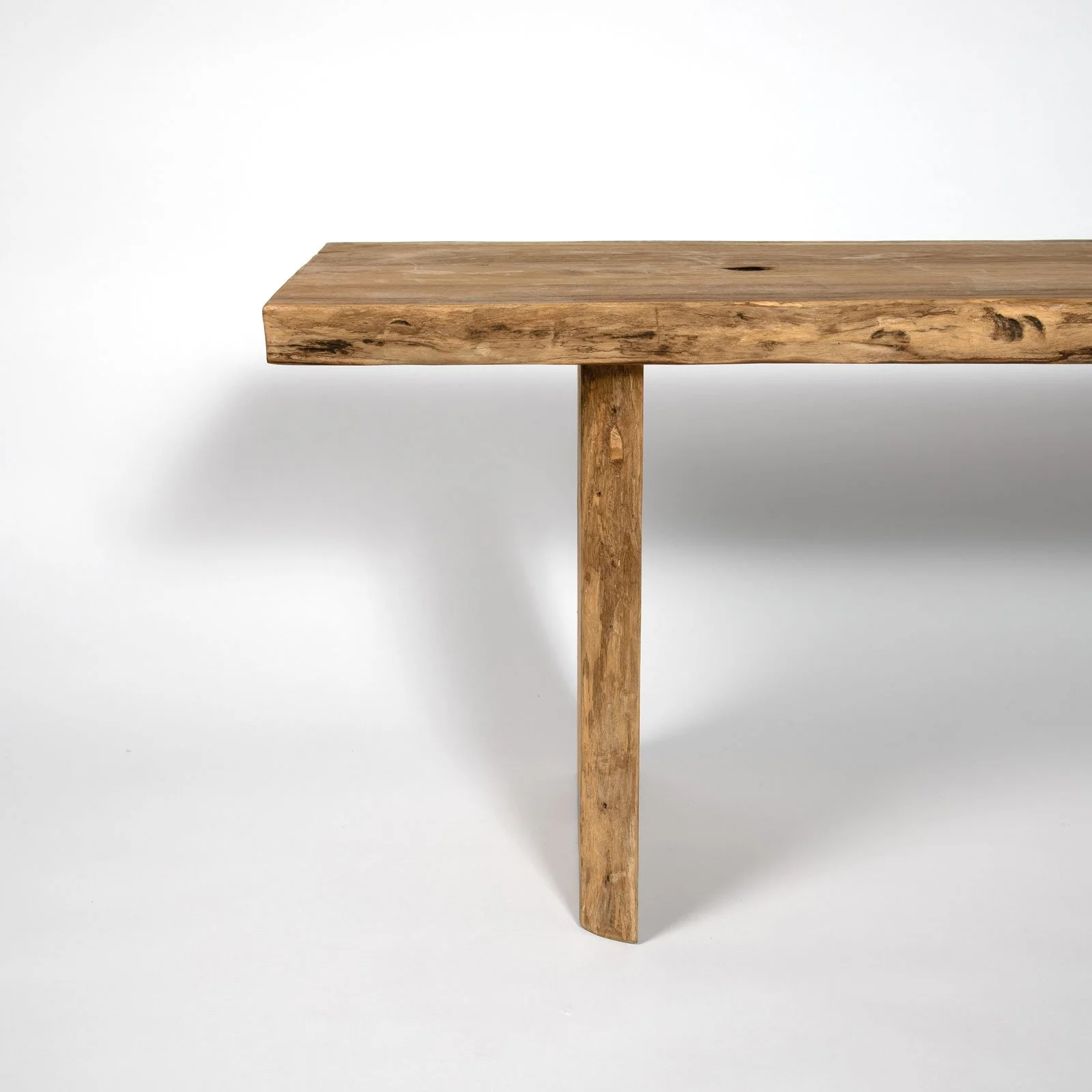 Front view of artisanal teak root bench showing unique shaping.jpg