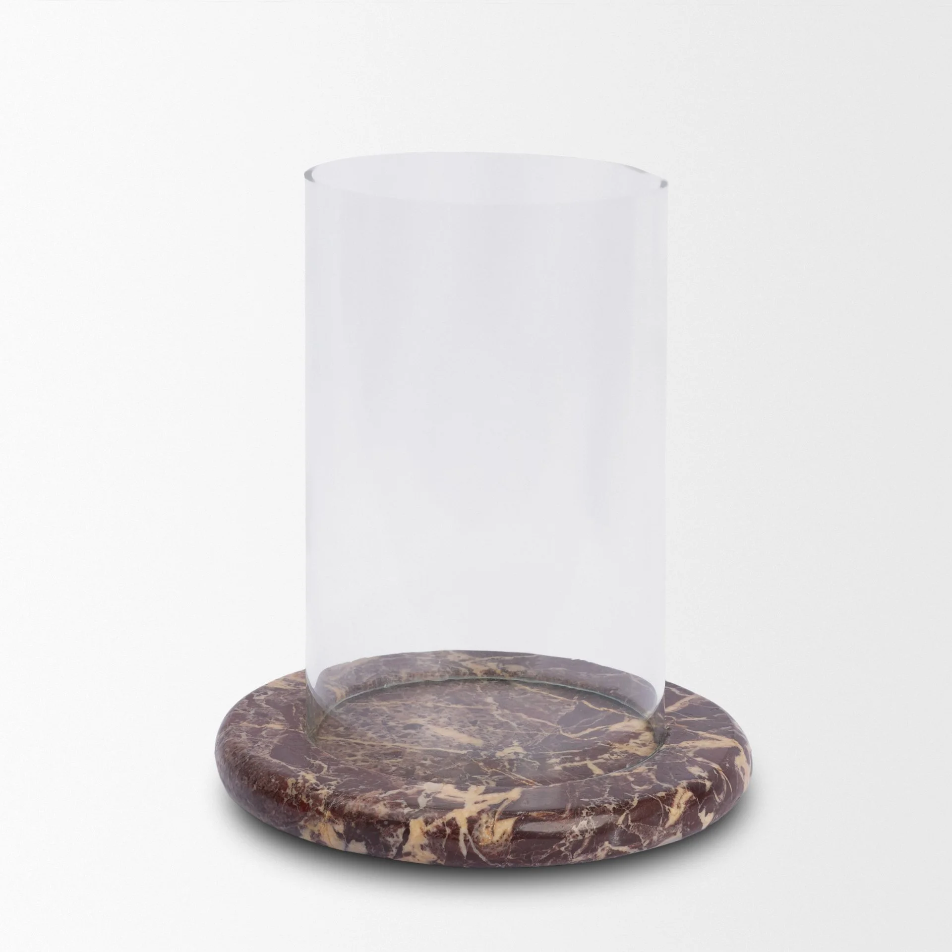 Front view of the empty red-brown marble candle holder without a pillar candle inside.