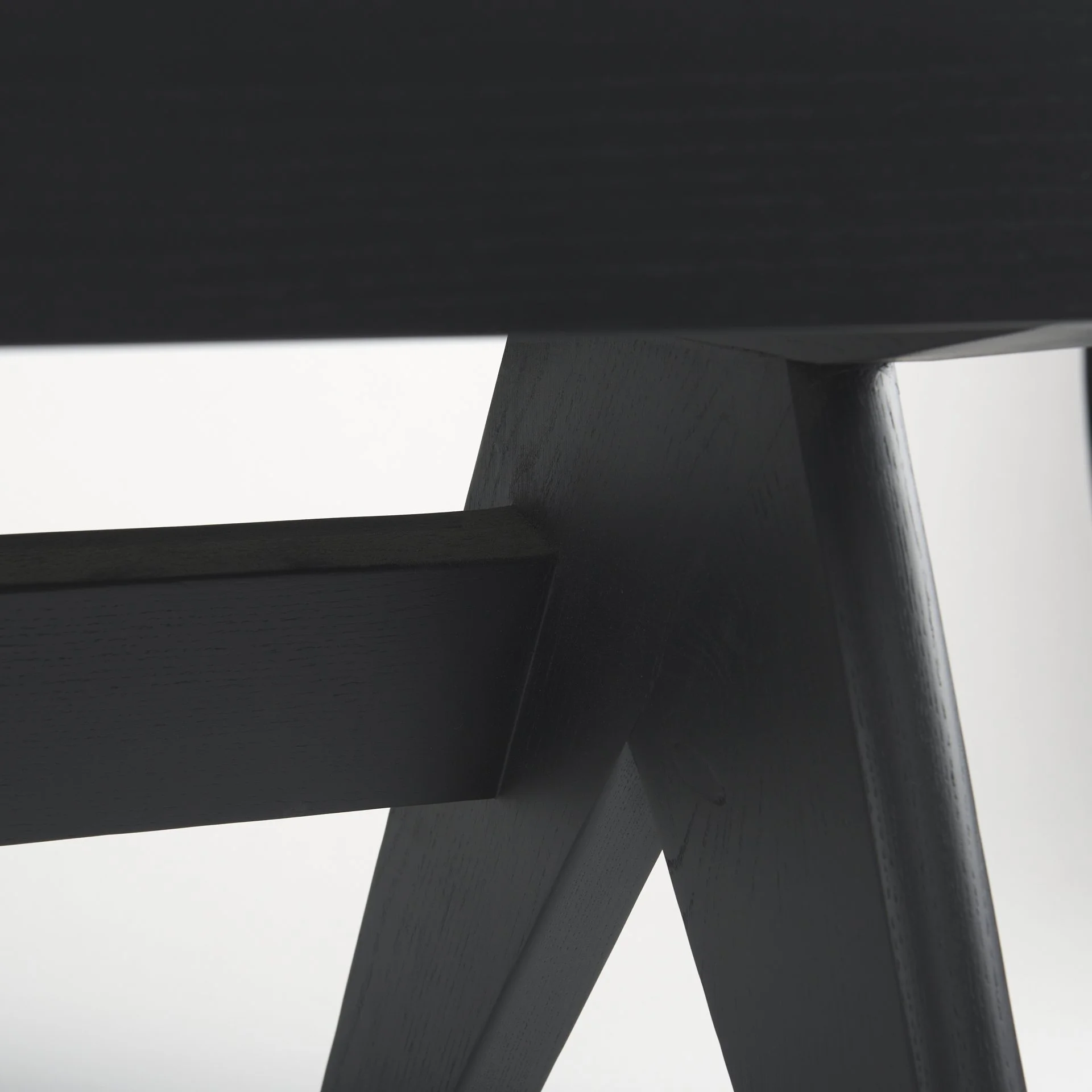 Solid wood Leg Detail on Cane and Wood Black Bench.jpeg