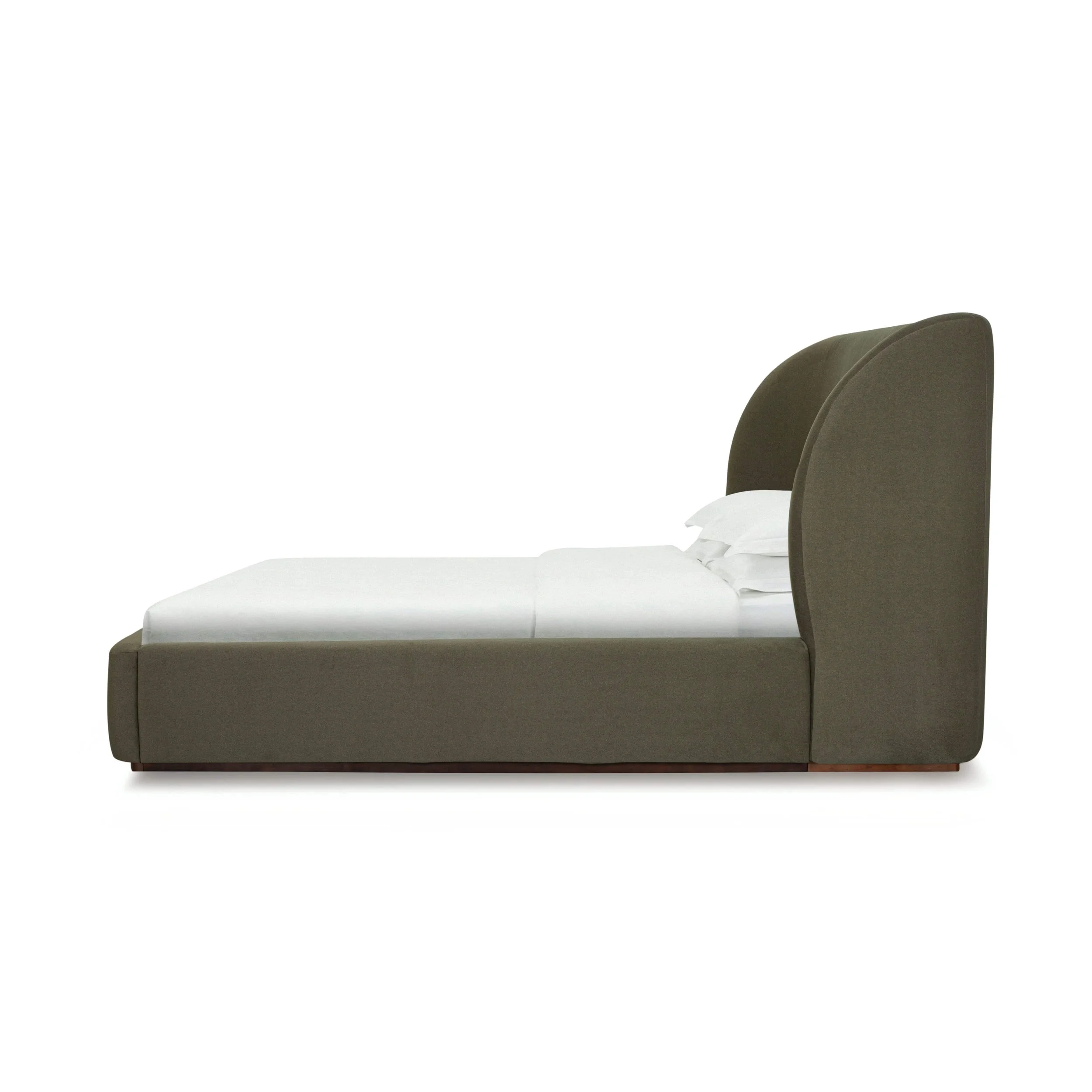 77 king size bed upholstered in deep green Velvet Fern fabric with winged headboard