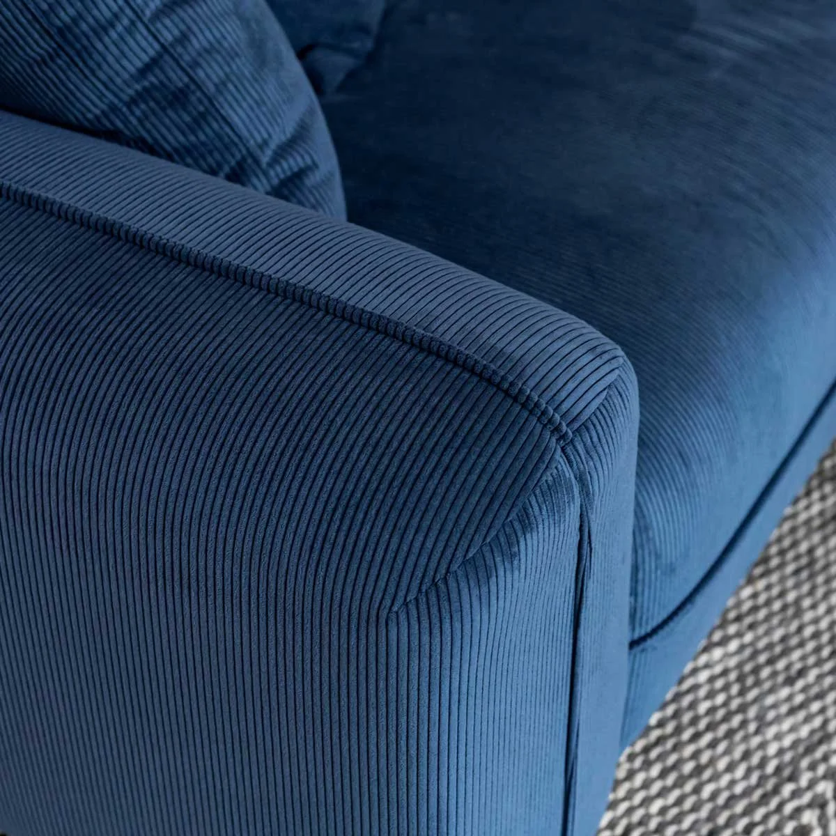 Arm rest on blue 3 seater sofa - made in Vancouver