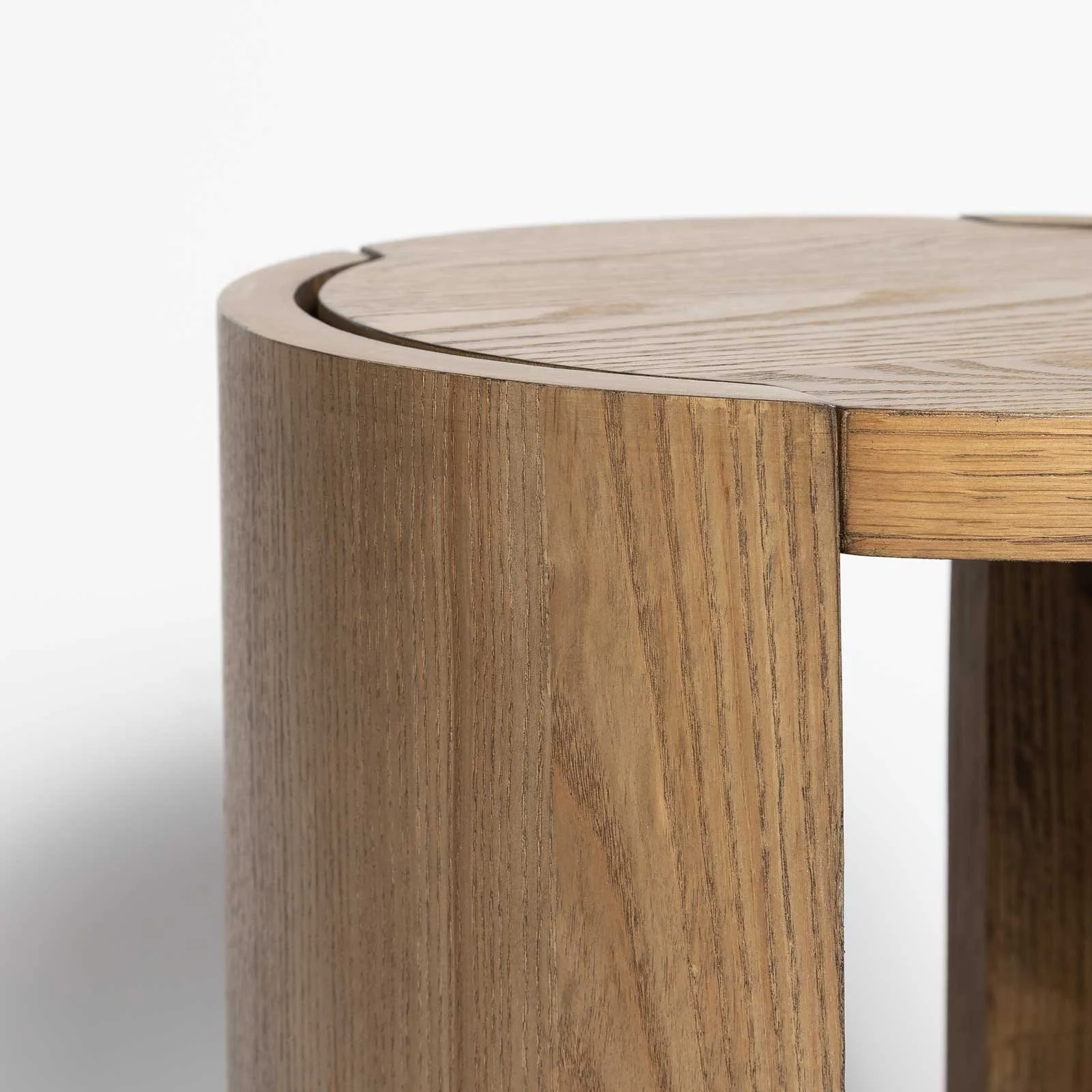 Close-up of natural oak wood grain and curved support panel on the 8 Side Table