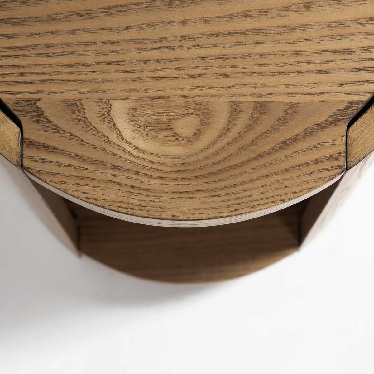 Angle view of modern c-pannel rustic oak side table