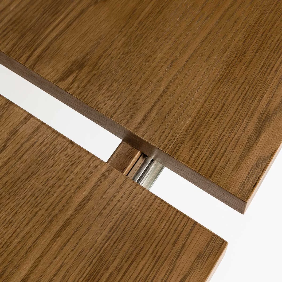 Dining table shown partially extended with extension panel visible