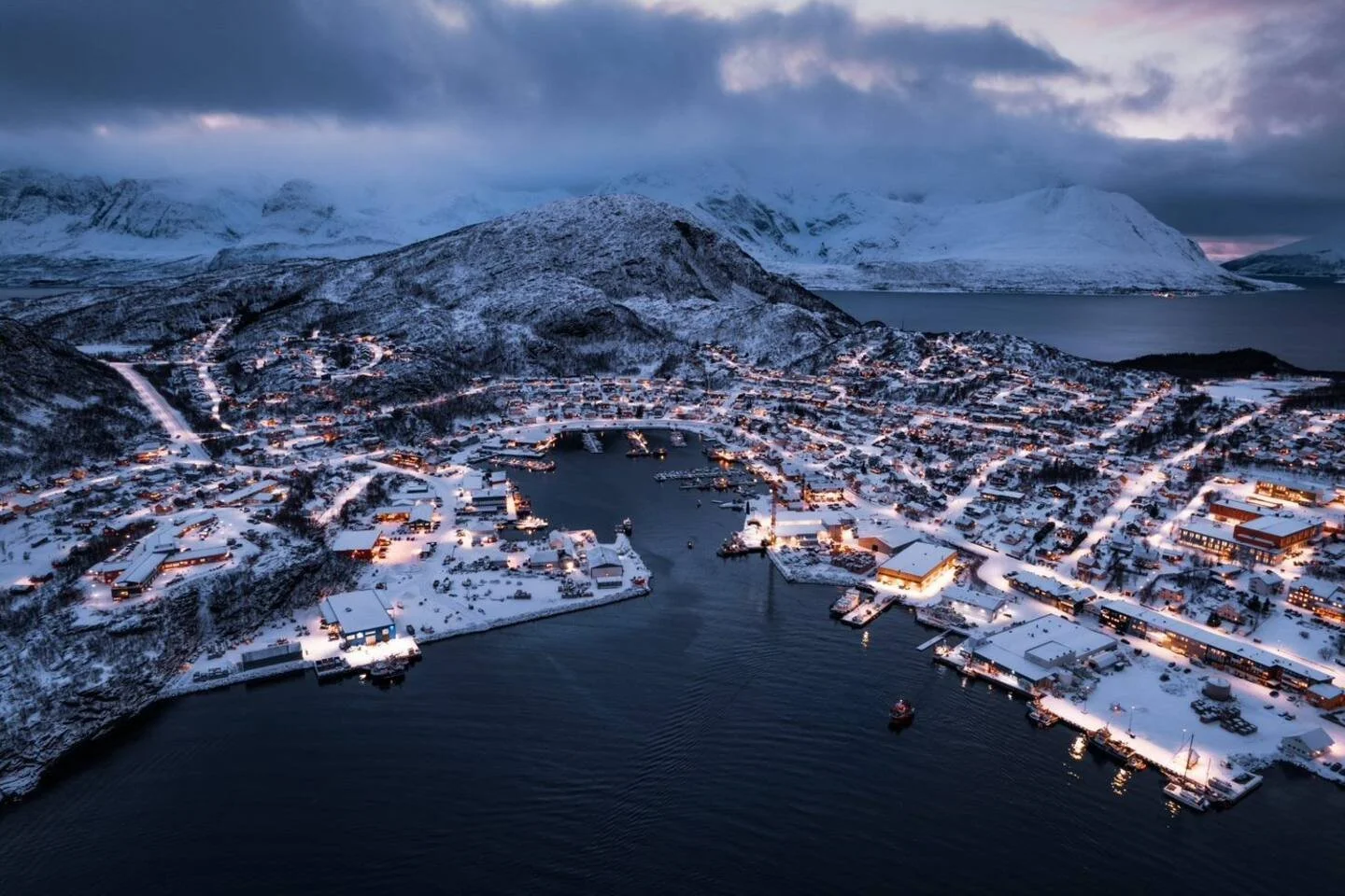 Skjervøy and the surrounding fjords from above at dusk