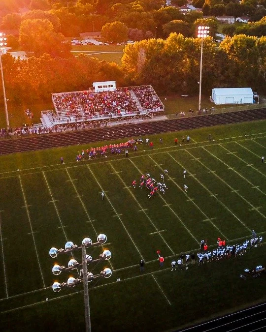 A high school football came on an athletic arena built by a Central Oregon football field builders.