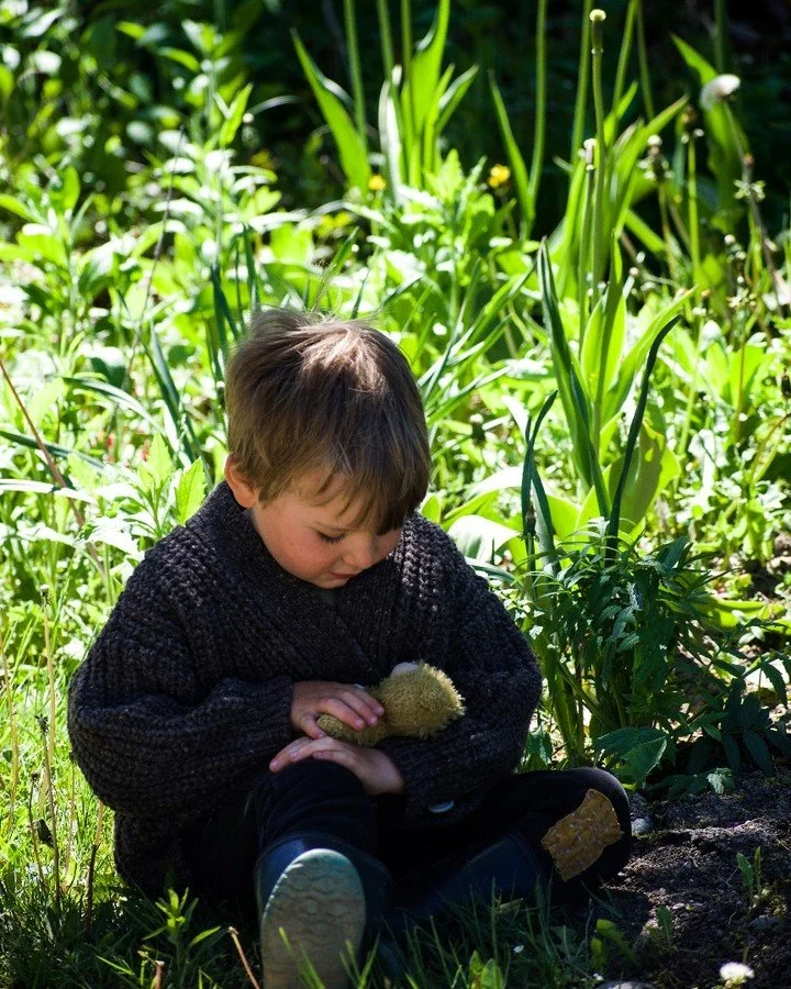 Corduroy the bear, receiving the utmost care. Max regularly changes his diaper, sings to him, rocks him to sleep in his &quot;carrier&quot; (a backpack which he has fashioned to fit on his front, just like mama's), and laughs and chats with him. Here
