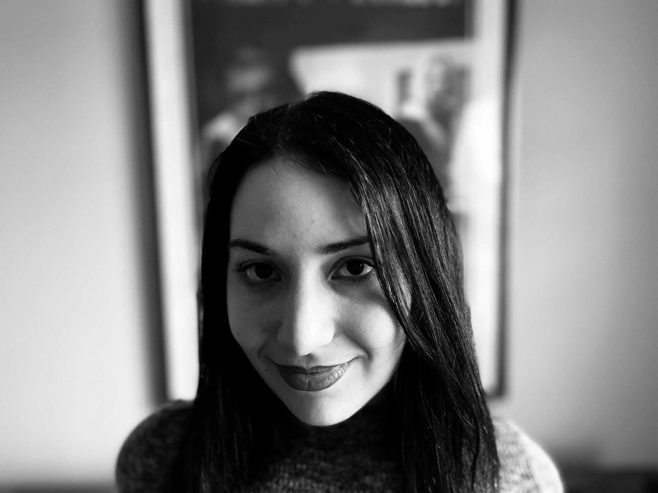 Black and white portrait of a woman smiling