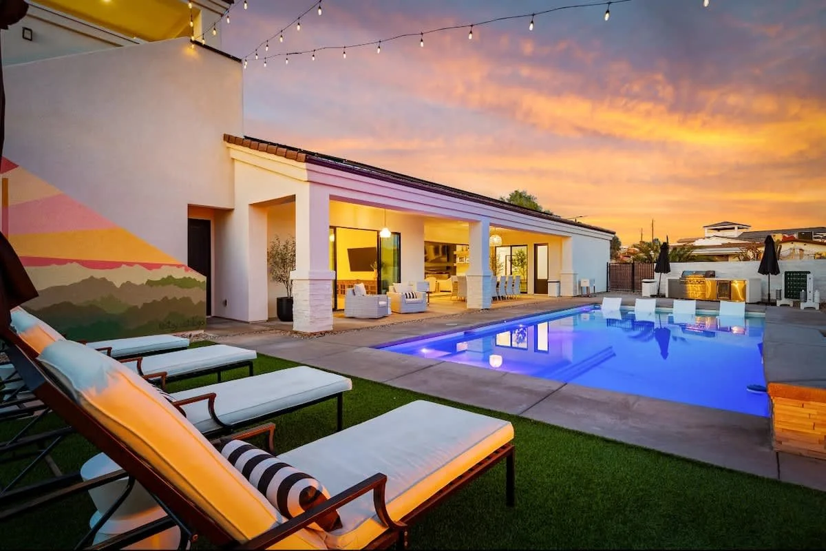 Vista Lago Backyard features a pool and outdoor dining area