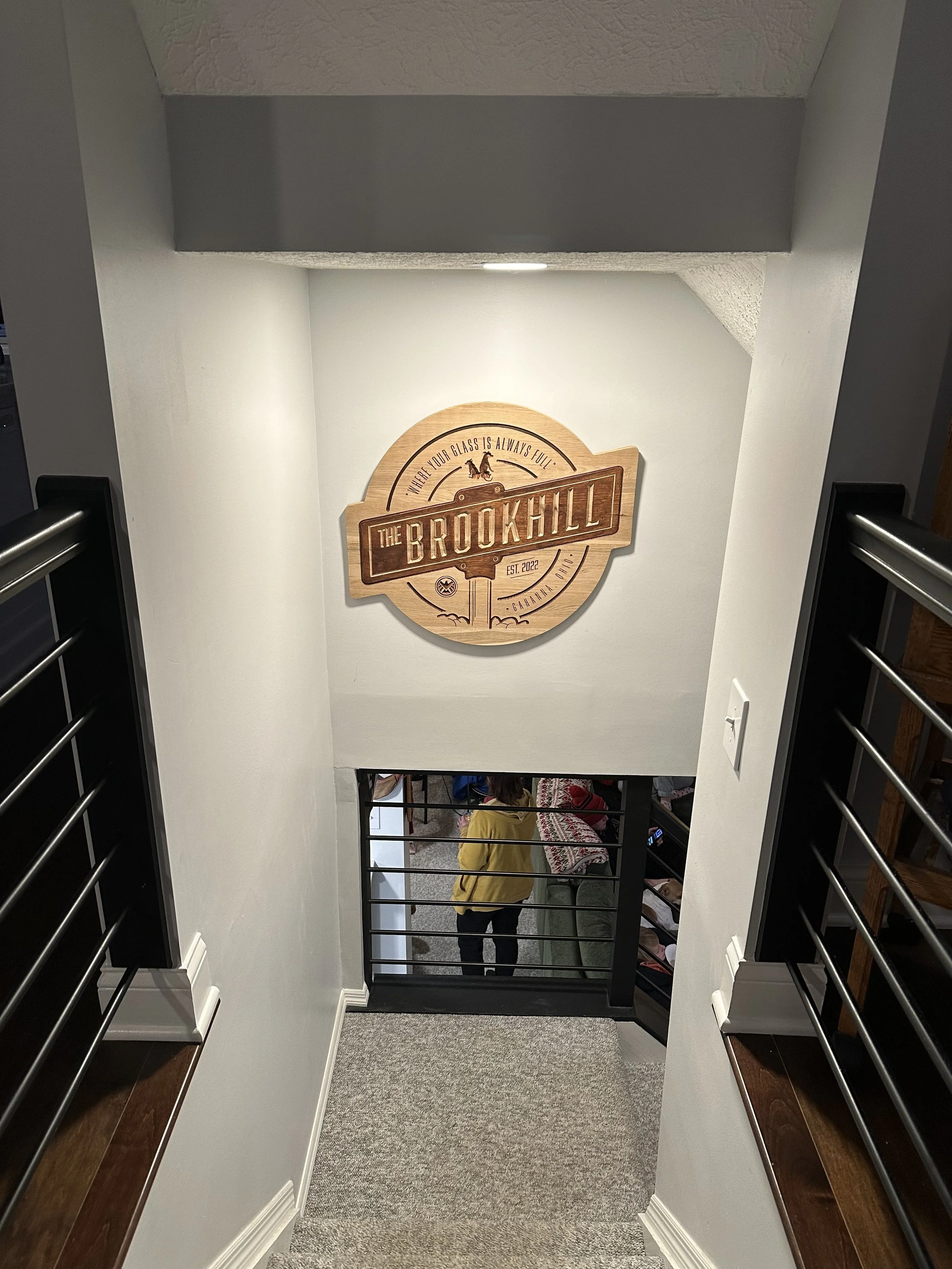Designed and fabricated custom home bar logo + pub sign. CNC'd image and then hand stained. 