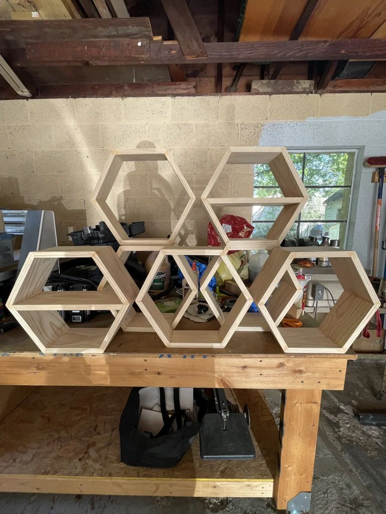 Hex shadow boxes. Built these out of poplar and finished with a clear coat for our living room.  