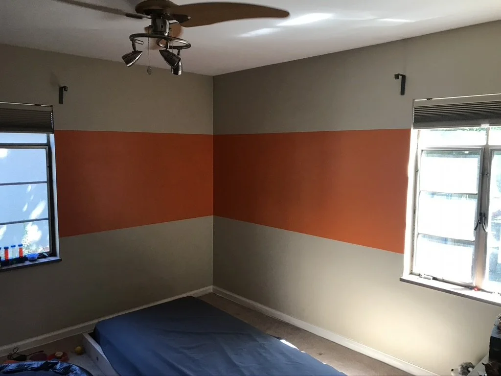 To free up space and make a fun/unique bed for our son, I built and installed a single bed frame suspended from the walls and the ceiling. This created space under the bed for a reading/play area and opened up the room. 