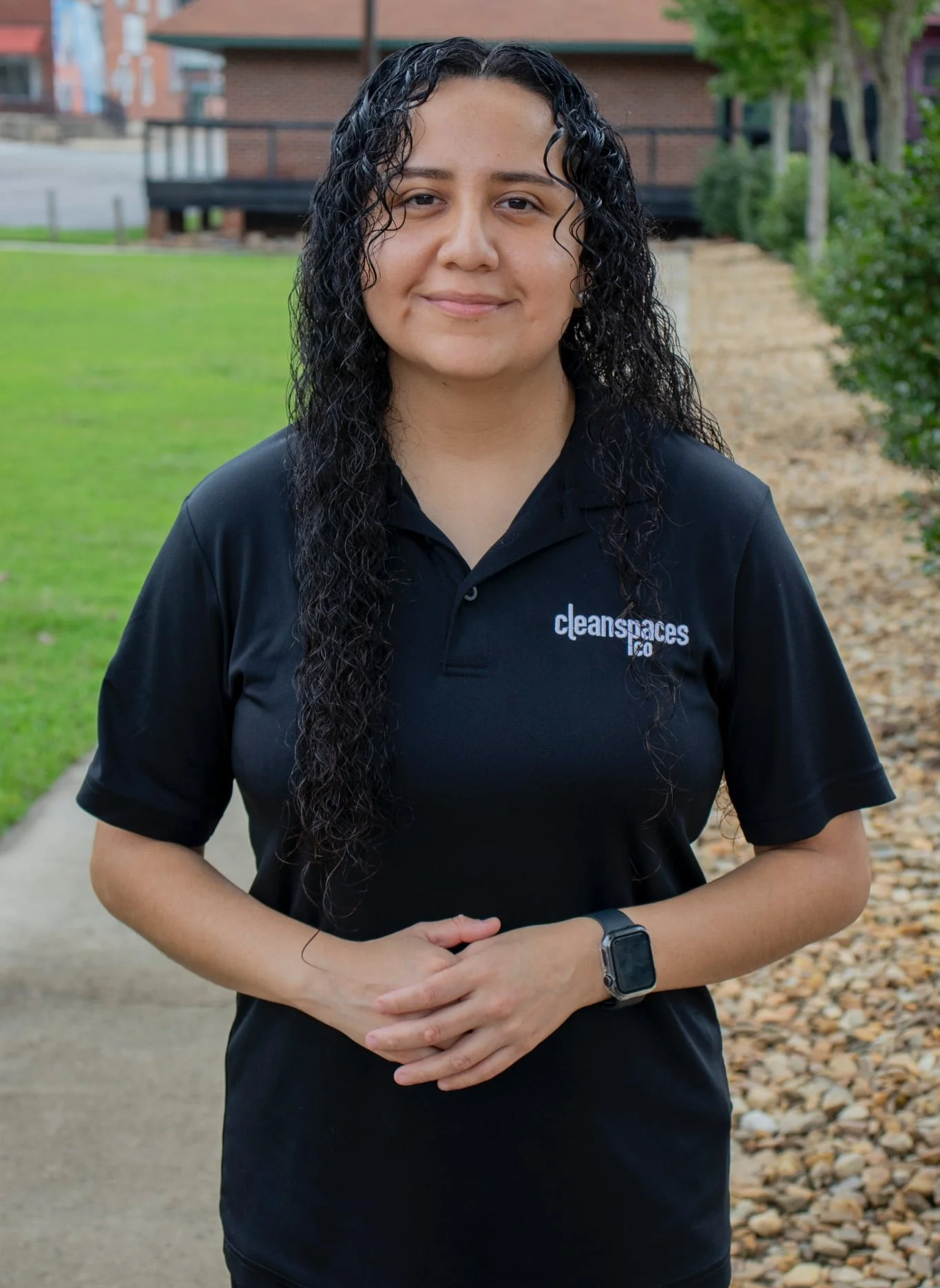 Owner of Clean Spaces Co standing outside wearing company uniform, serving local commercial cleaning clients in Moore County North Carolina, Randolph North Carolina, and Montgomery North Carolina.