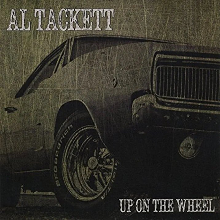 Al Tackett Up On The Wheel.jpeg
