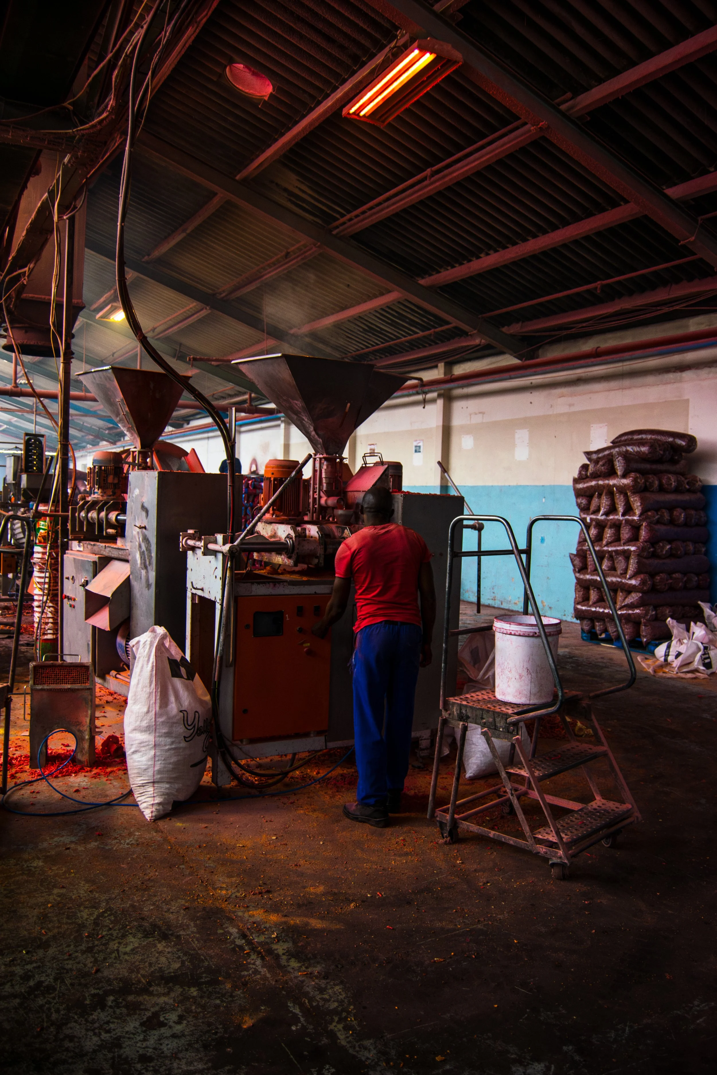 Chip Factory worker using the machinery at 7am in the morning