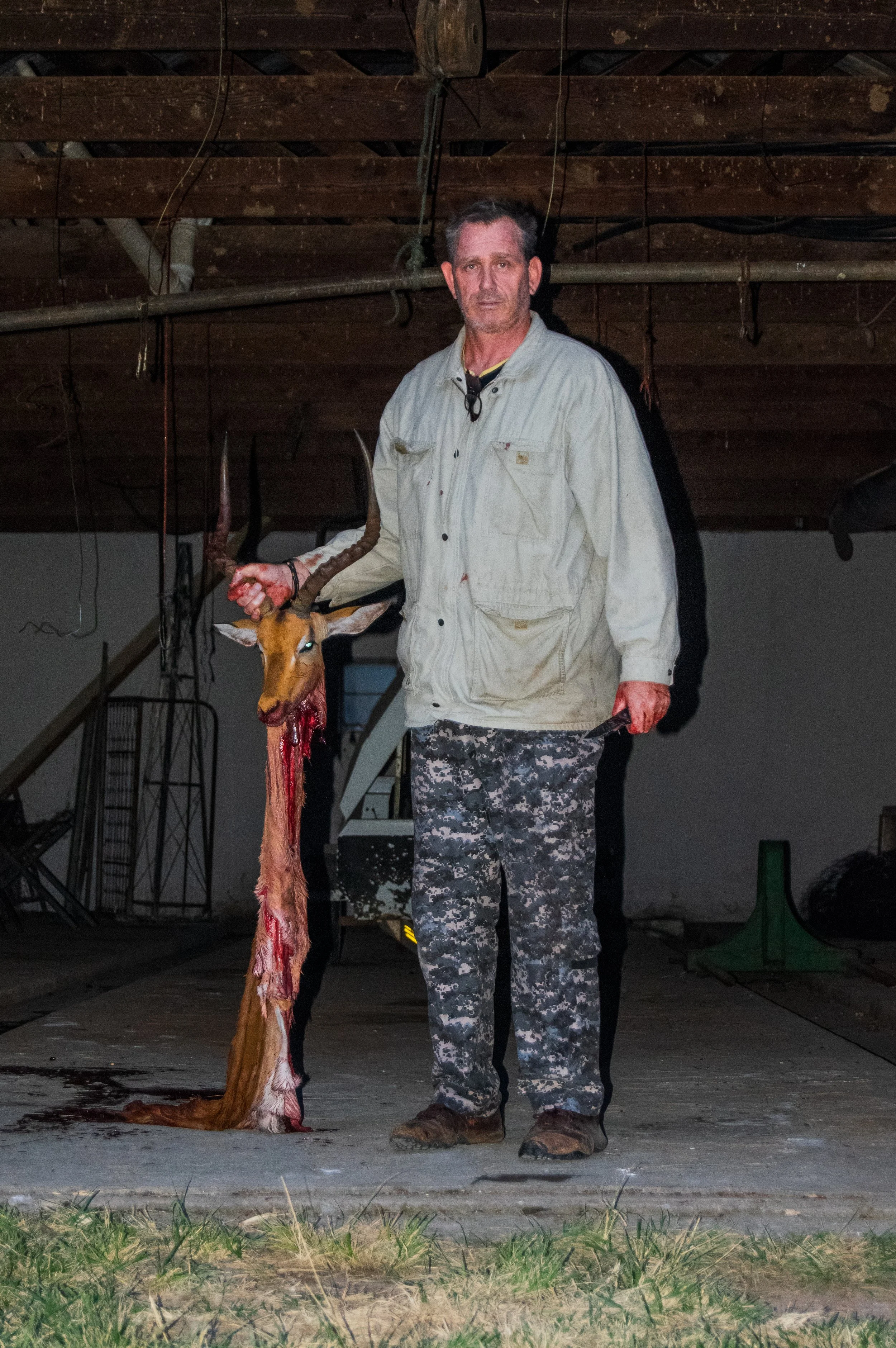 Posed with the cape of the animal after completing the skinning process (Cape is the head and skin)
