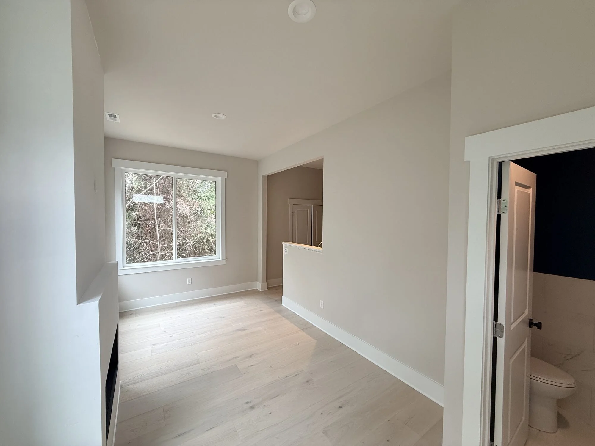 After — finished interior with fresh trim, doors, and flooring