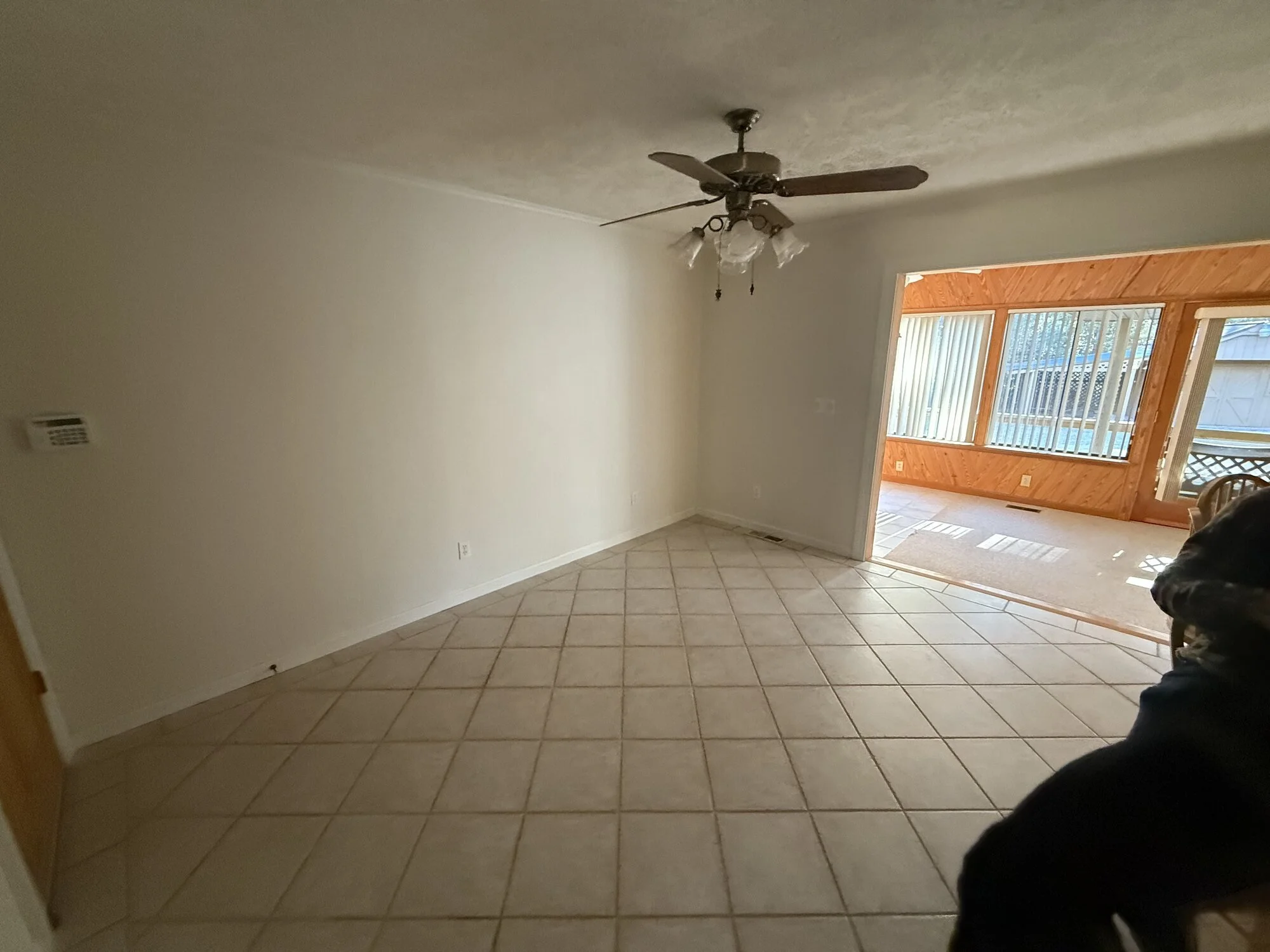 Before — kitchen and breakfast area with old tile floor