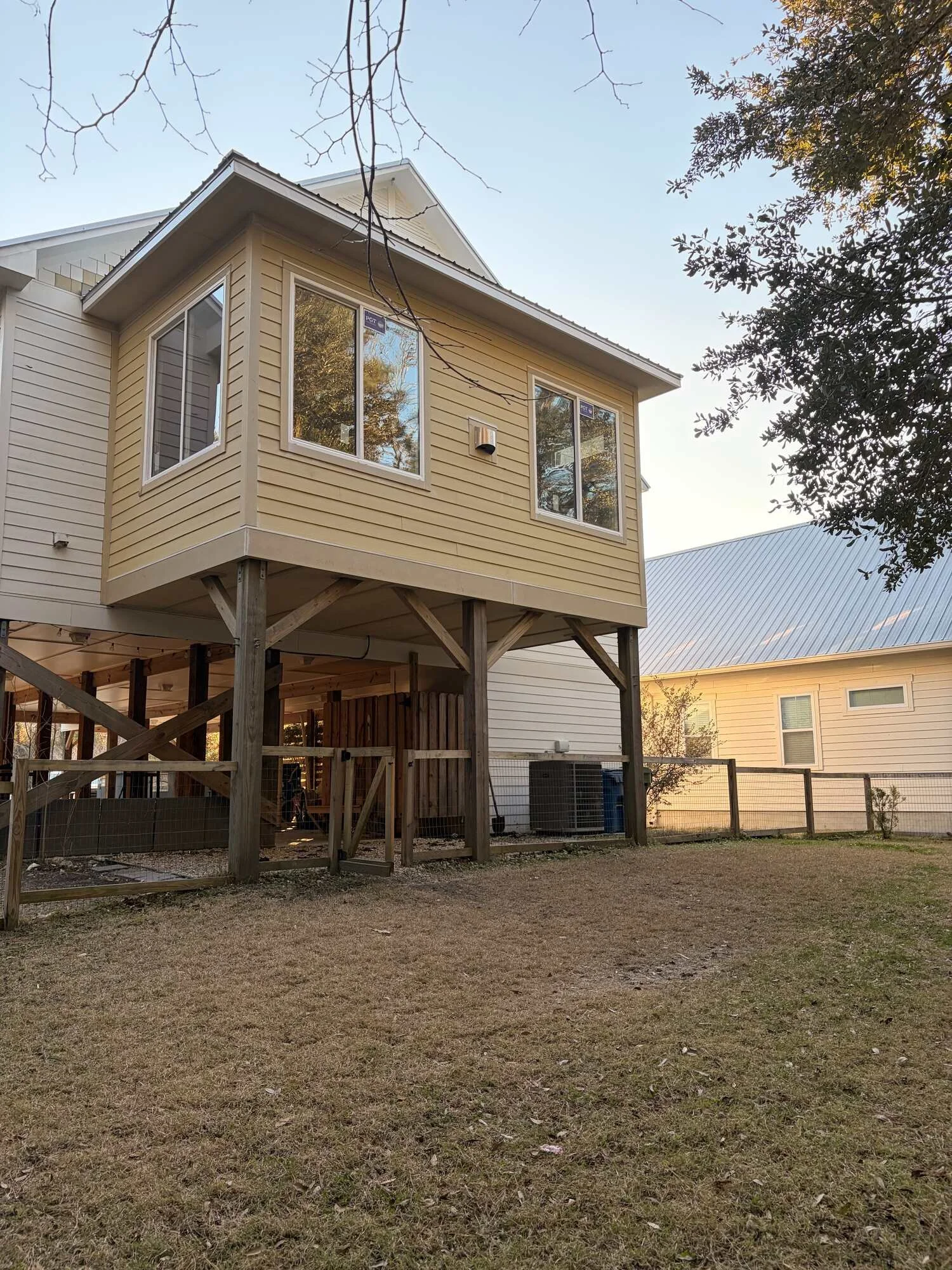 After — the almost finished addition standing tall on timber posts only lacking paint
