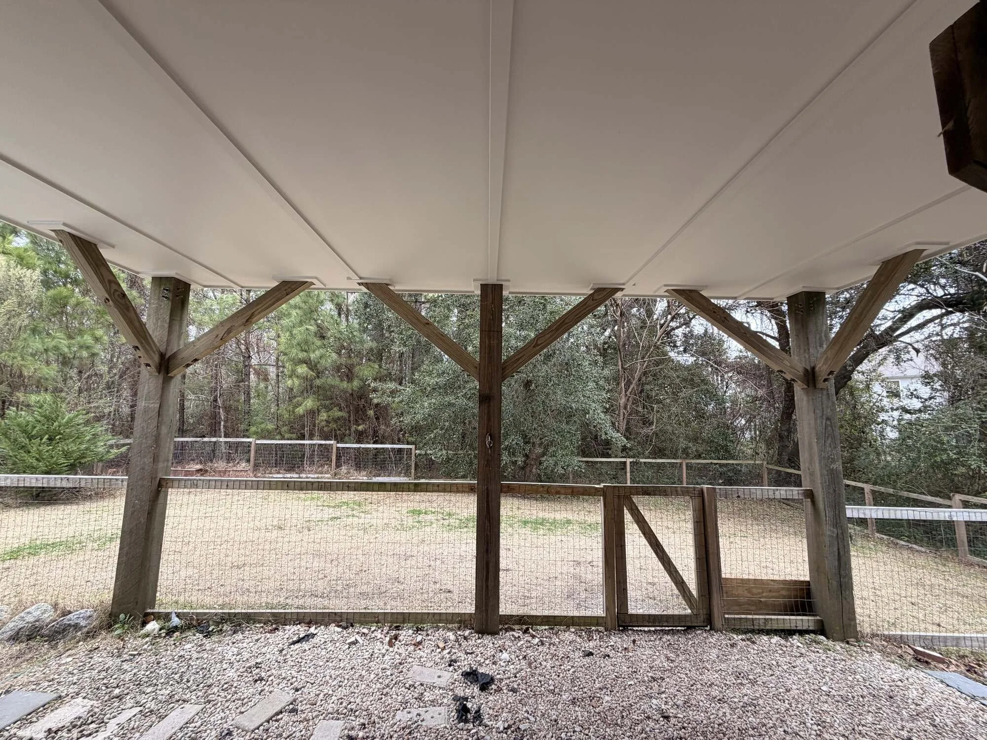 After — the timber post structure carrying the addition overhead