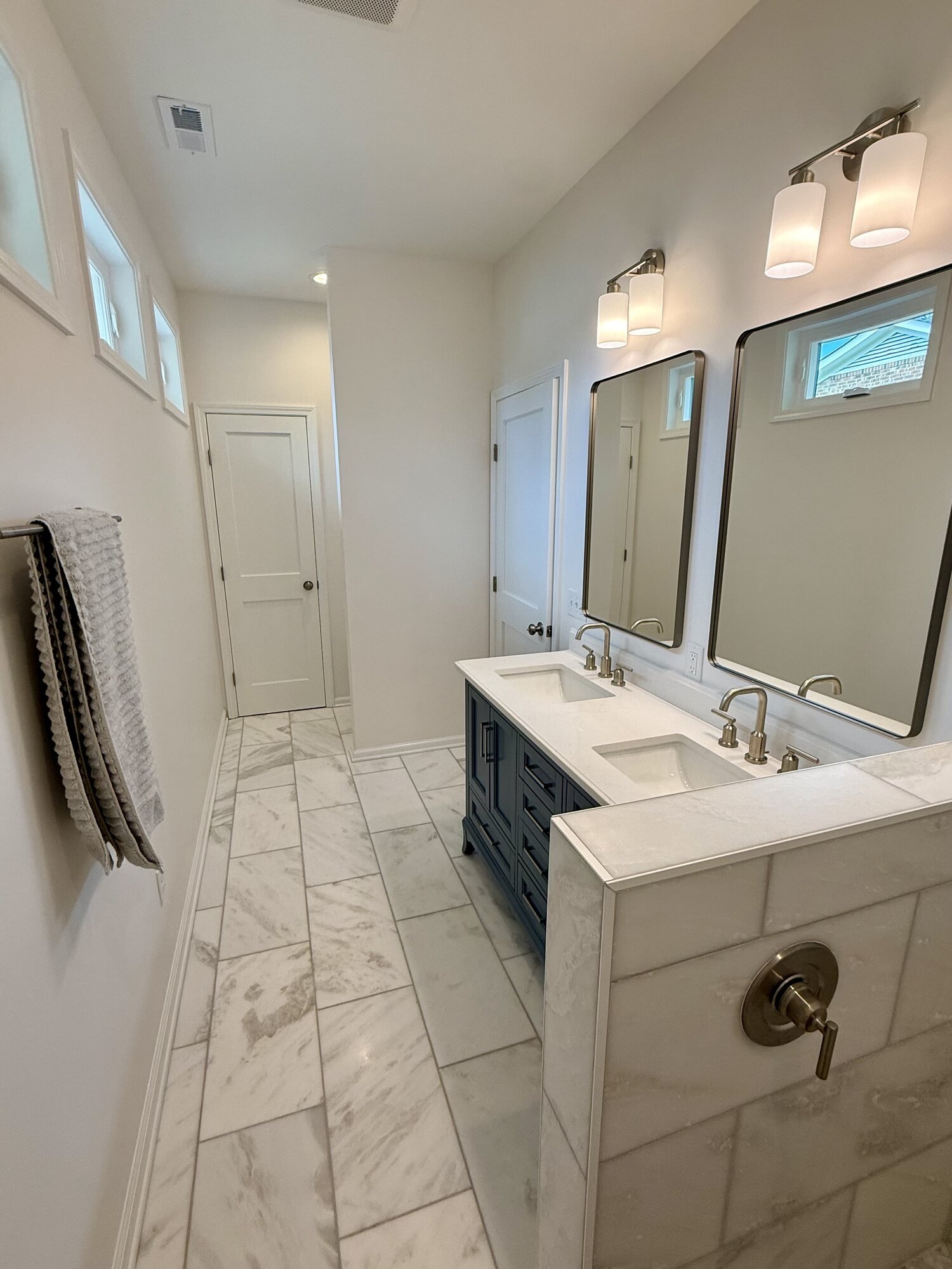 After — vanity and mirror detail in the finished master bath