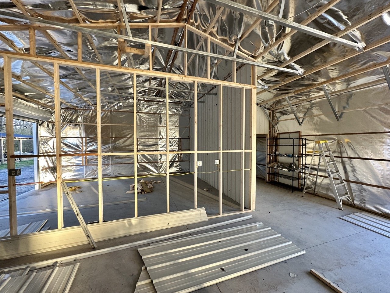 Framing interior walls of farm shop build