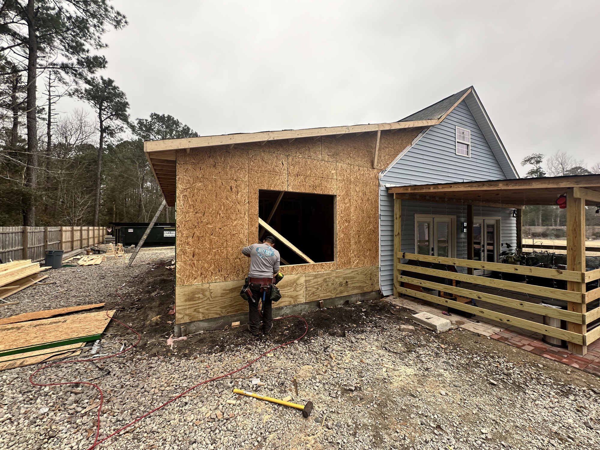 During — sheathing on and window openings cut