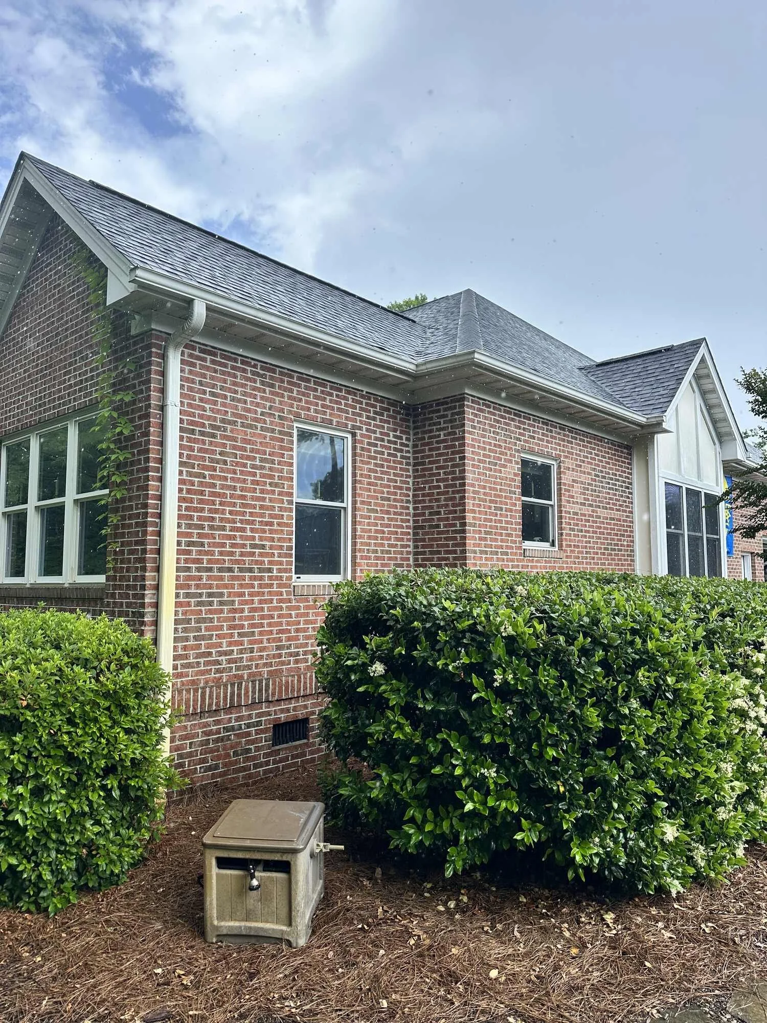 Before — the original brick elevation at the addition corner