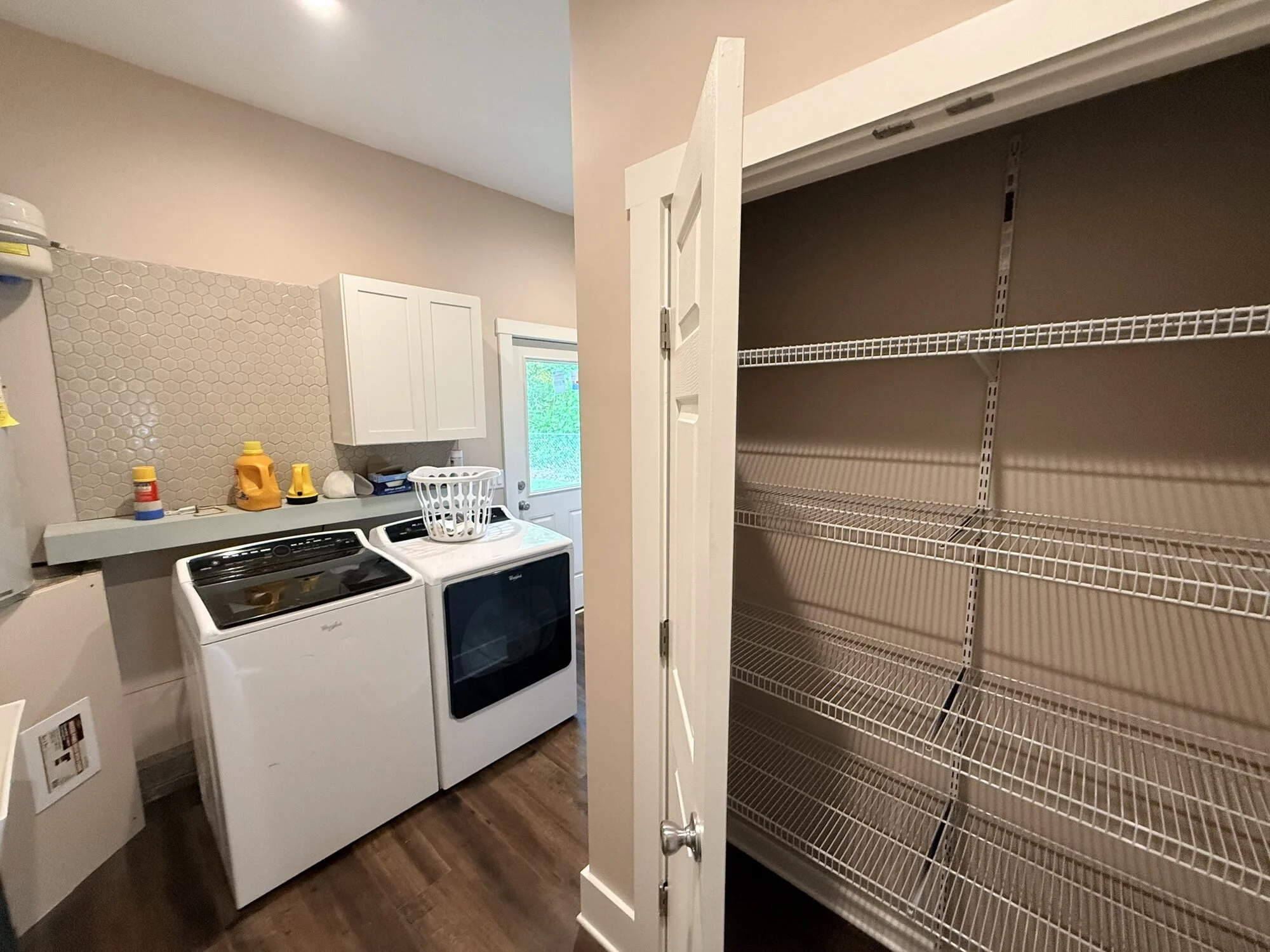 After — utility sink and pantry shelving by the new interior door
