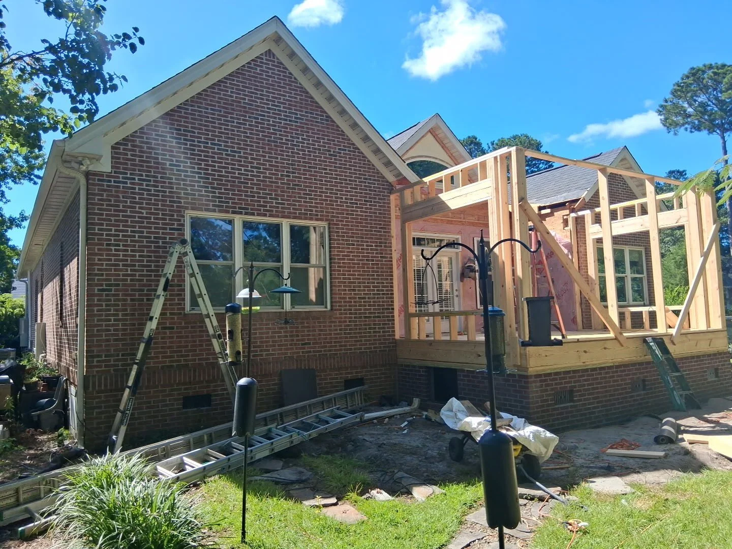 During — the addition taking shape against the original brick