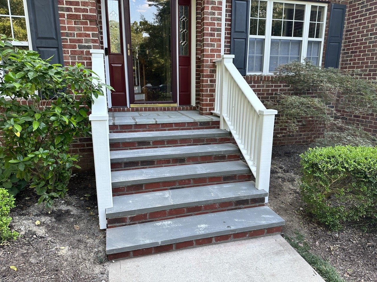 Extended stoop and installed stone treads