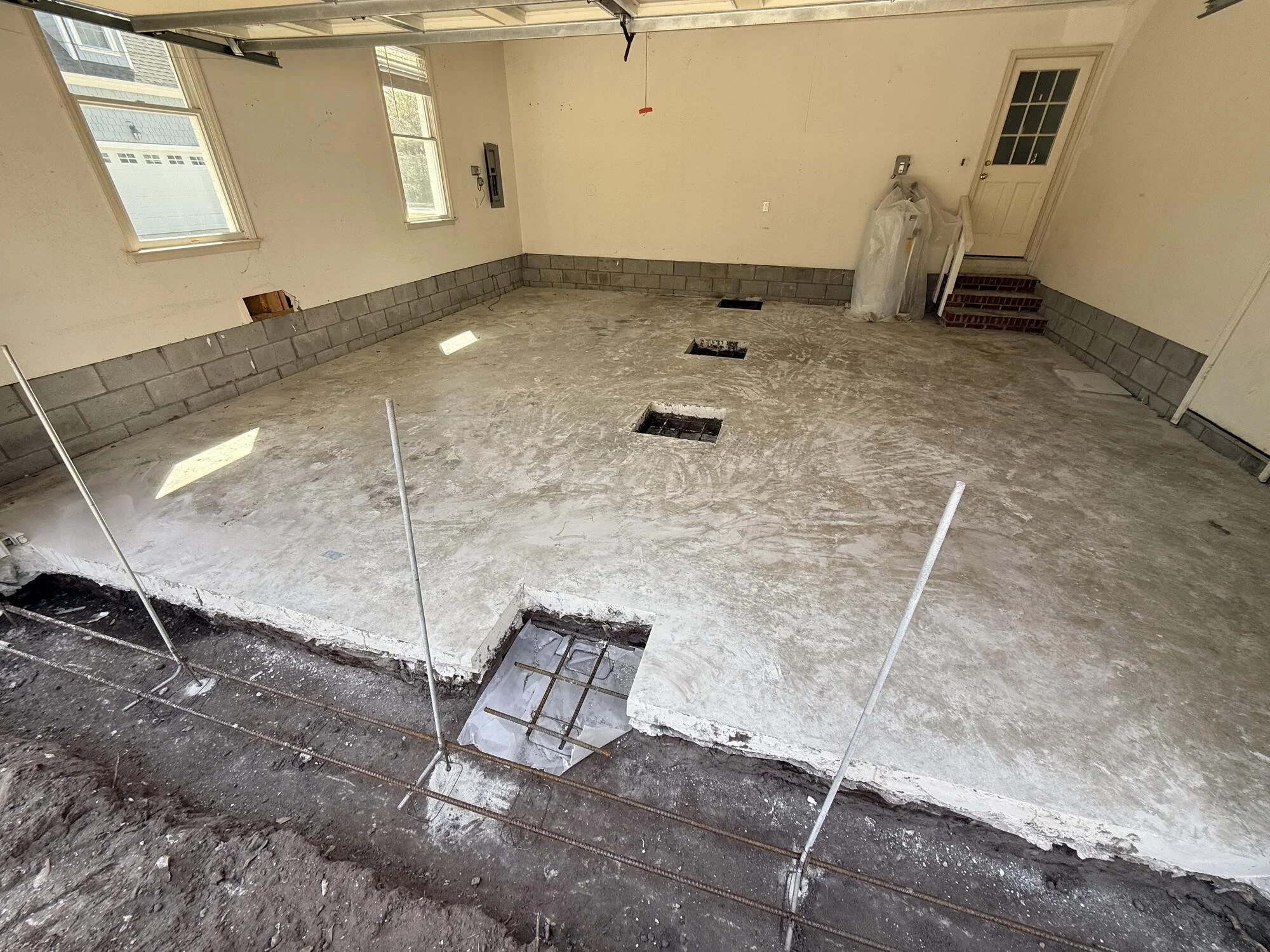 During — Footings cut into slab to make ready new floor supports