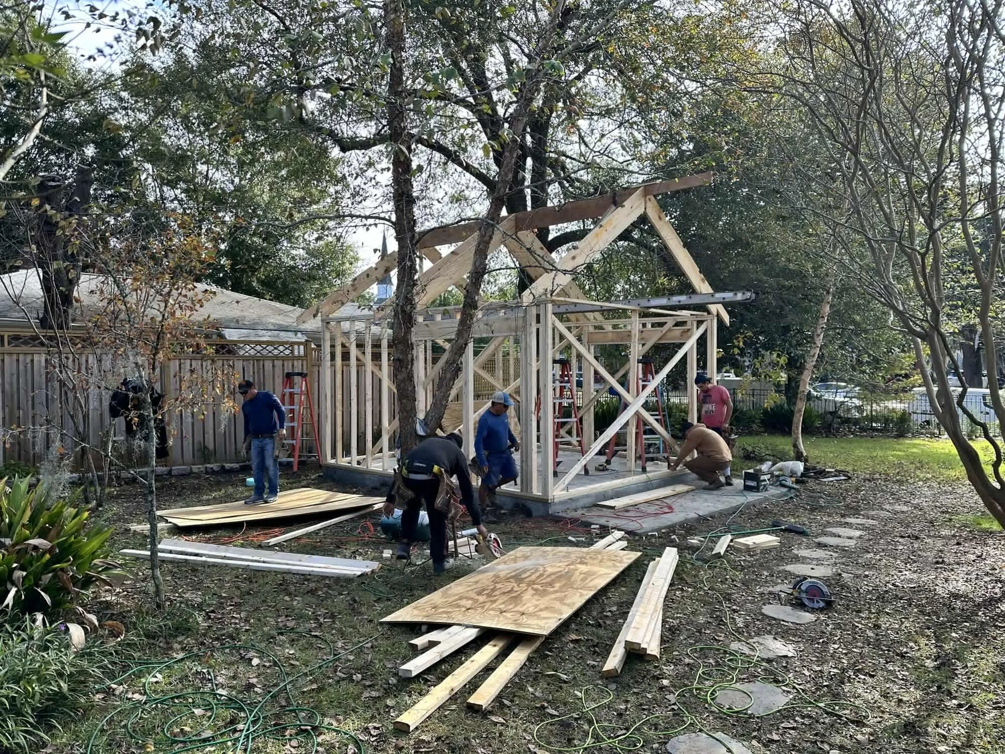 Setting the roof framing on the Central Blvd backyard studio in Wilmington, NC — gable and rafters going up