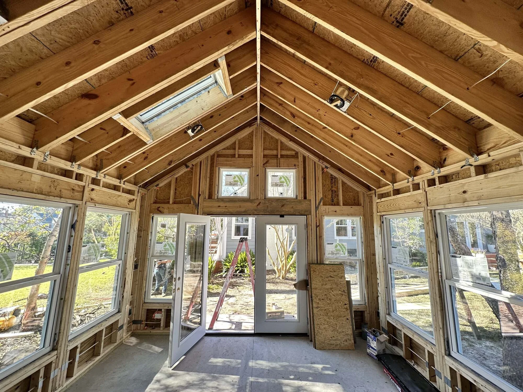 Windows, French doors, and skylights installed under the vaulted ceiling of the Central Blvd studio, Wilmington NC