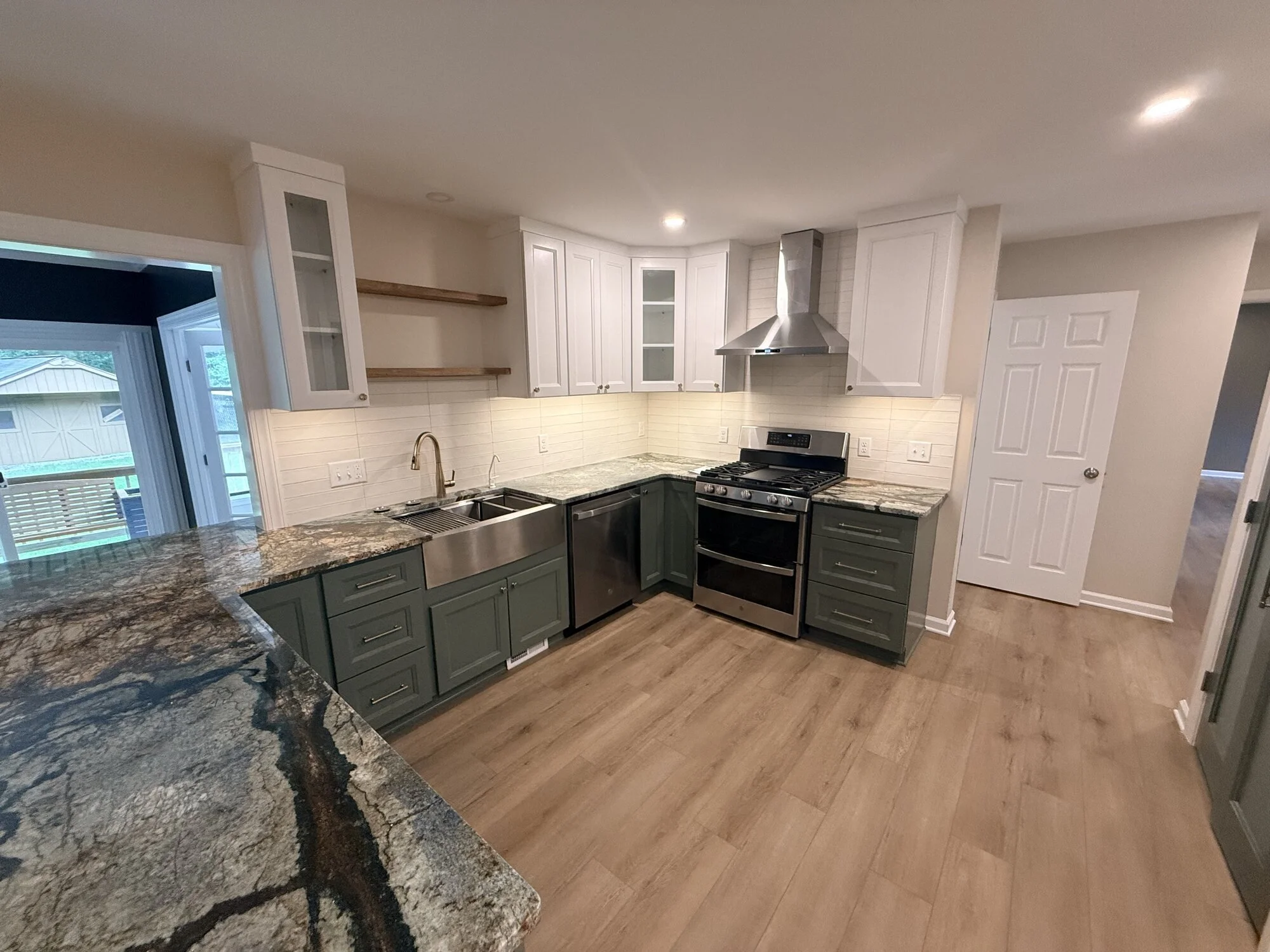 After — the finished kitchen, bright and open from every angle
