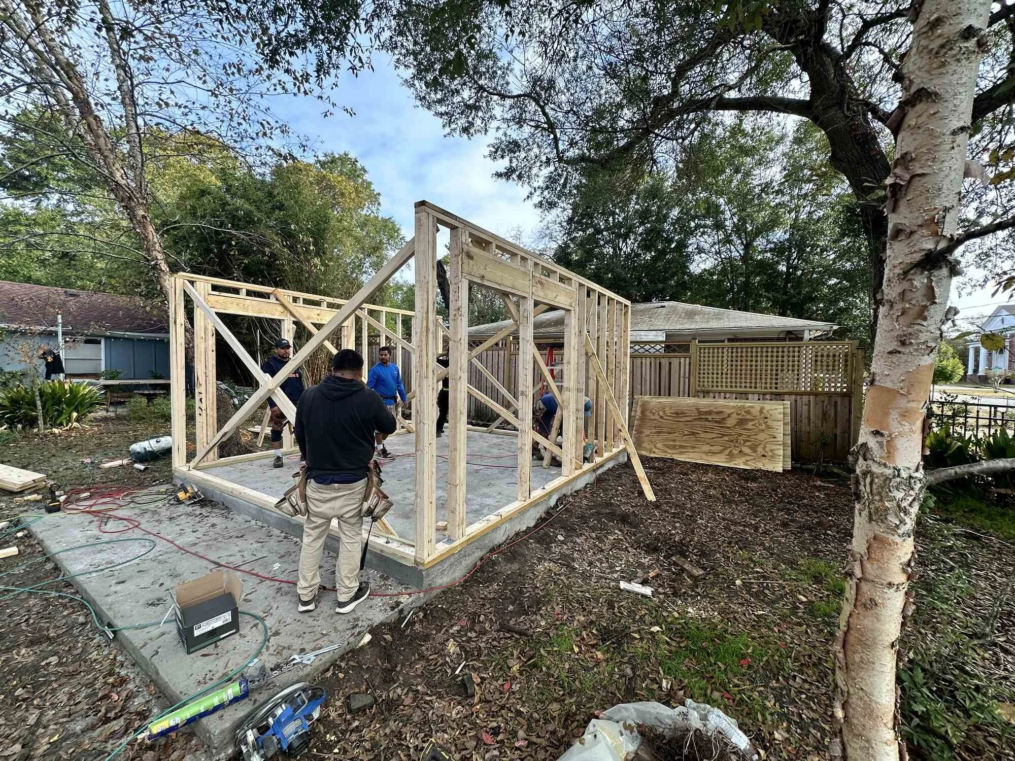 Framing the custom backyard studio walls on Central Blvd in Wilmington, NC — Stenersen Construction crew on site